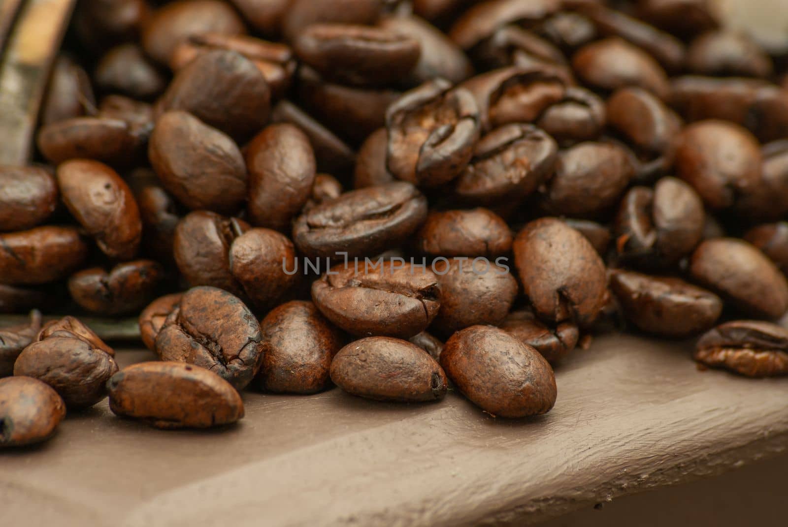 roasted coffee beans on a wood background