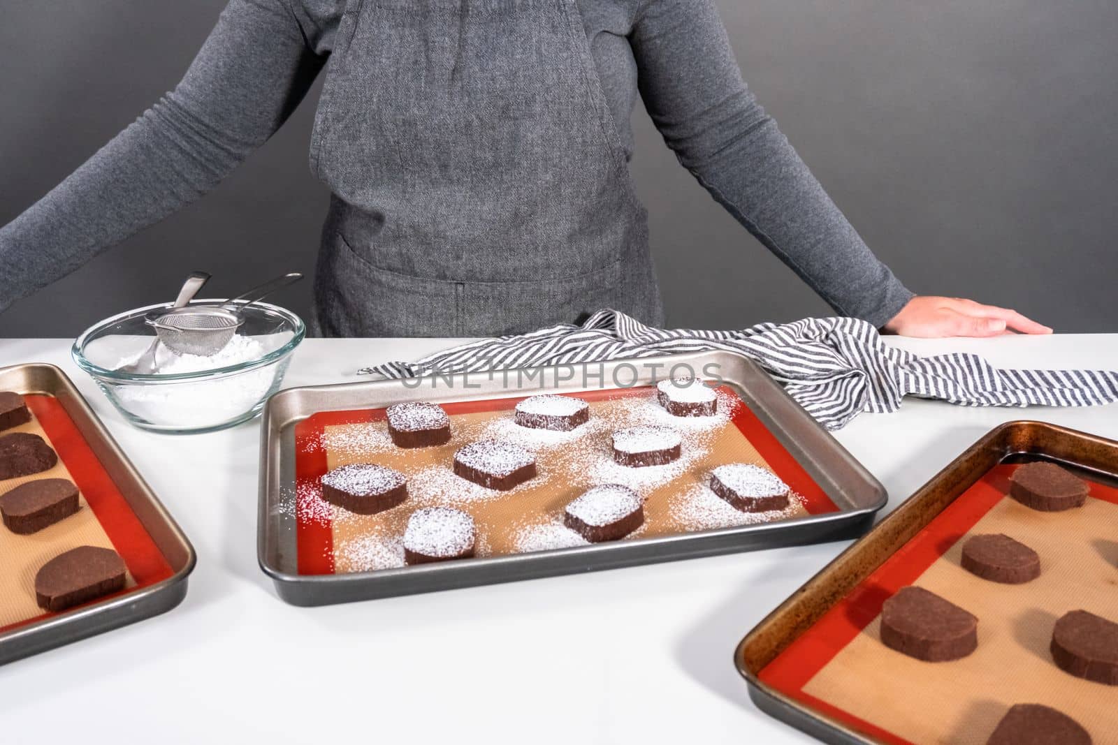 Unbaked chocolate cookies on a baking sheet.