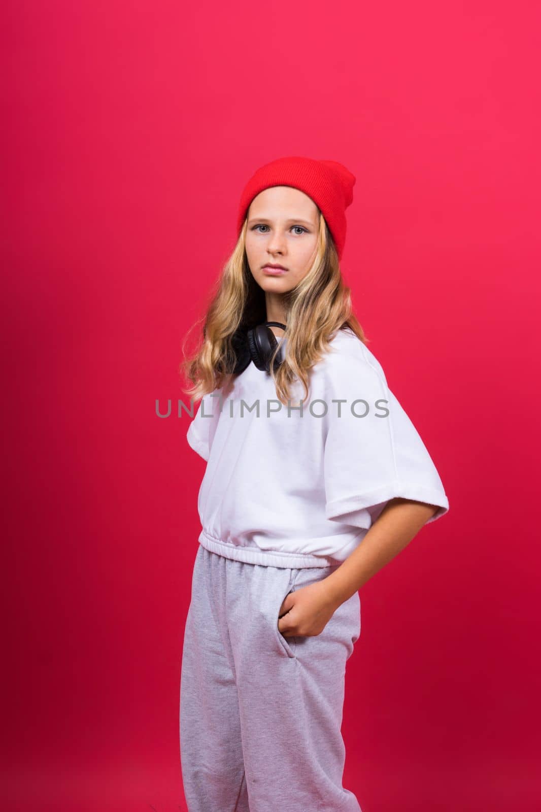 Child music concept. Teenager girl dance in rhythm of melody, listens song in headphones