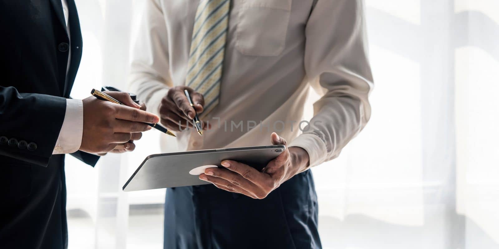 Businessman and partner hand using digital tablet and making presentation business strategy....