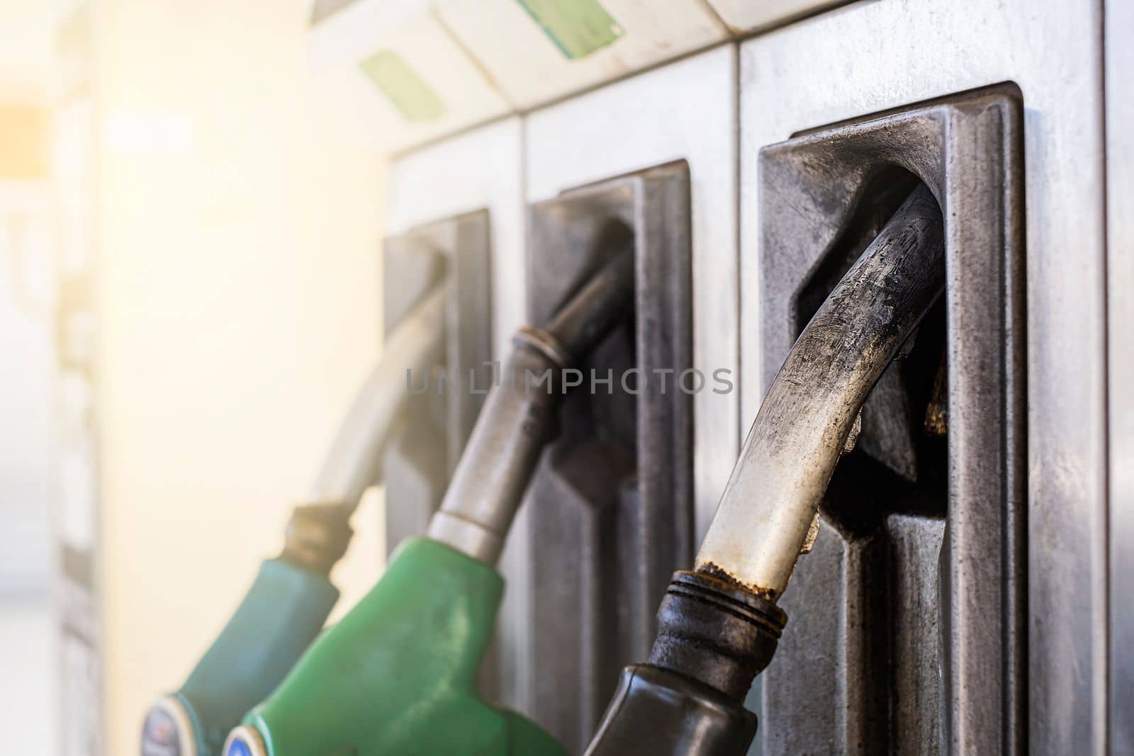 Service gas station with fuel, oil, gasoline and diesel. Close-up of a gas pump fueling gun. Petrol station. Italy