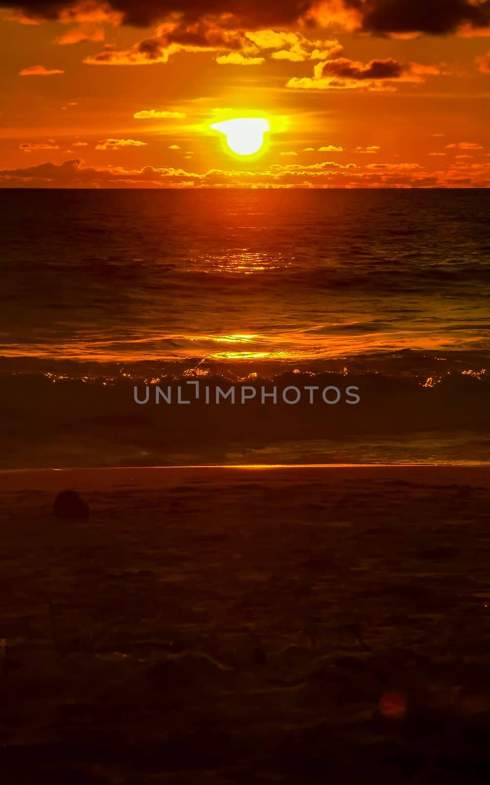 Colorful golden sunset big wave and beach Puerto Escondido Mexico. by Arkadij