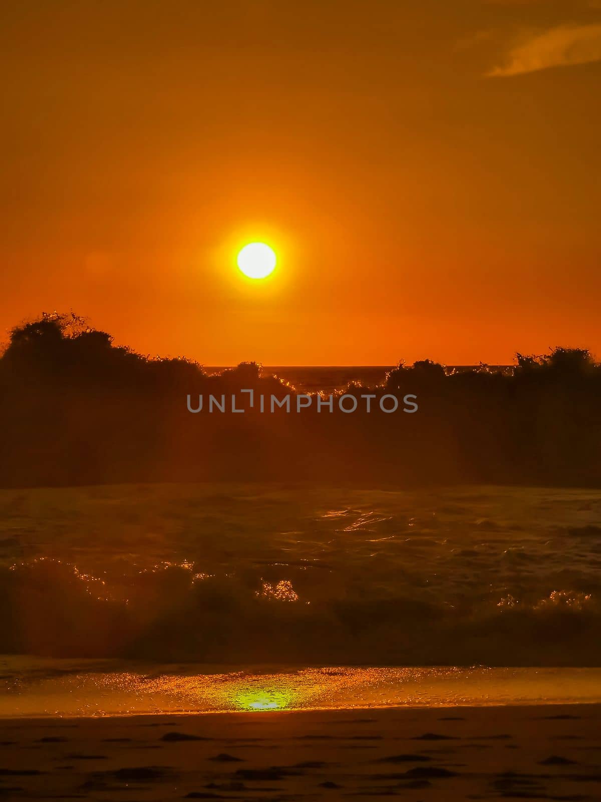 Colorful golden sunset big wave and beach Puerto Escondido Mexico. by Arkadij