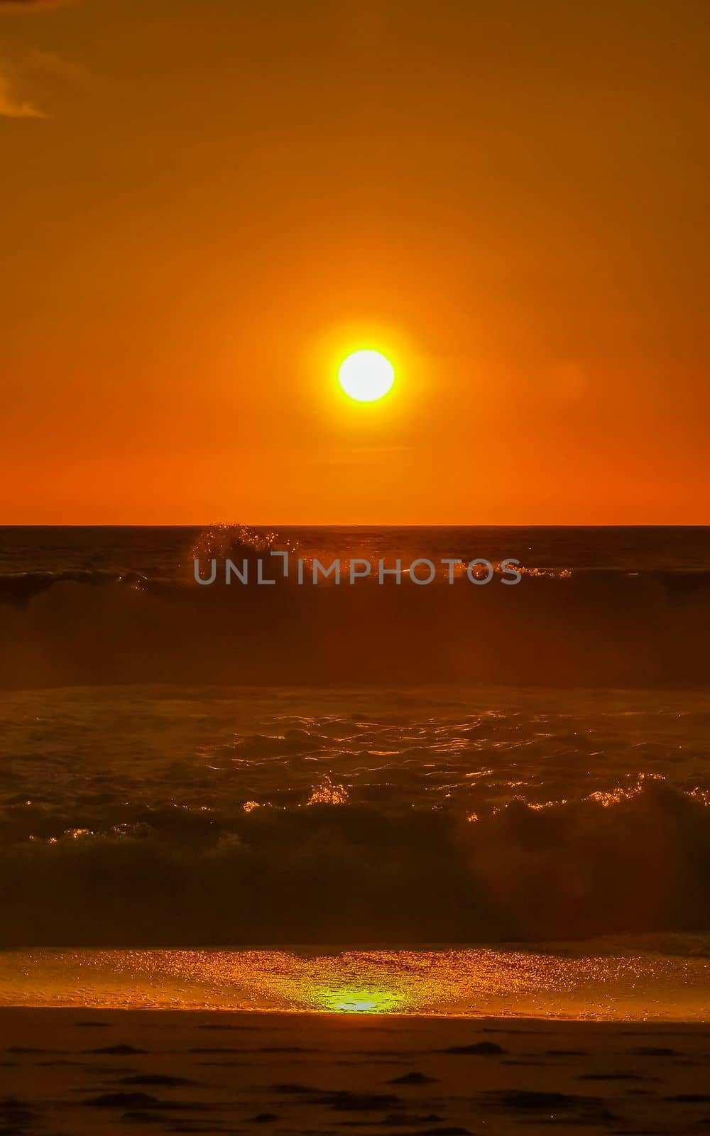 Colorful golden sunset big wave and beach Puerto Escondido Mexico. by Arkadij