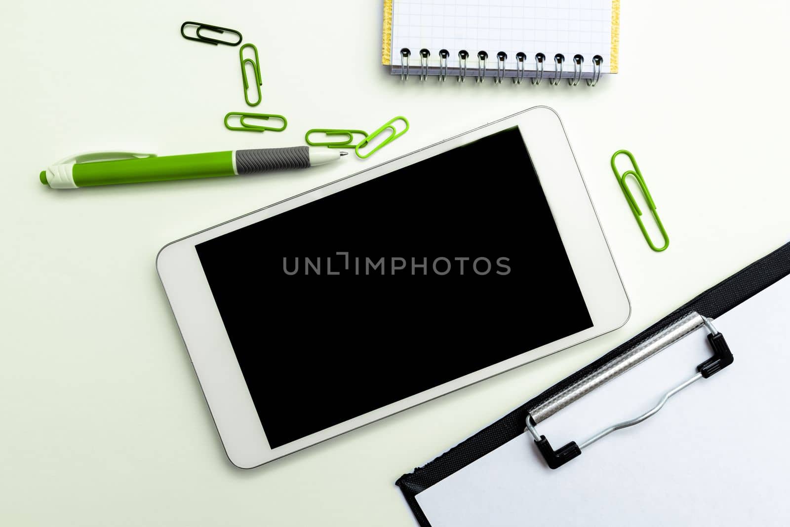 Phone Screen With Important Message On Desk With pens, Calculator And Notebook. Cellphone With Crutial Information On Table With Cup. Late Updates Presented. by nialowwa