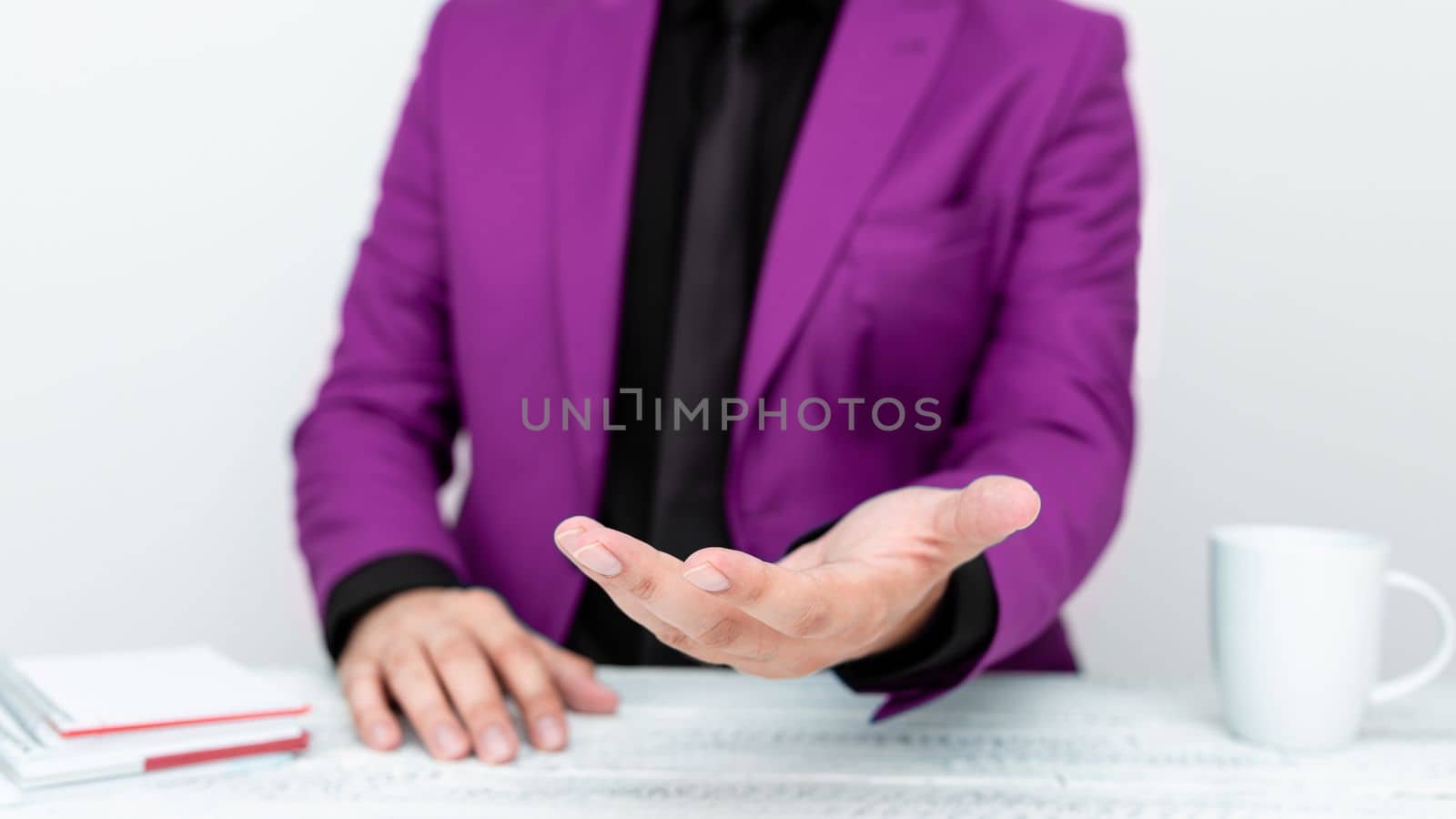 Businessman in Pink jacket Holding Important Message In One Hand. Man In Suit Showing New Crutial Idea In Palm. Executive Presenting Updated Critical Information. by nialowwa