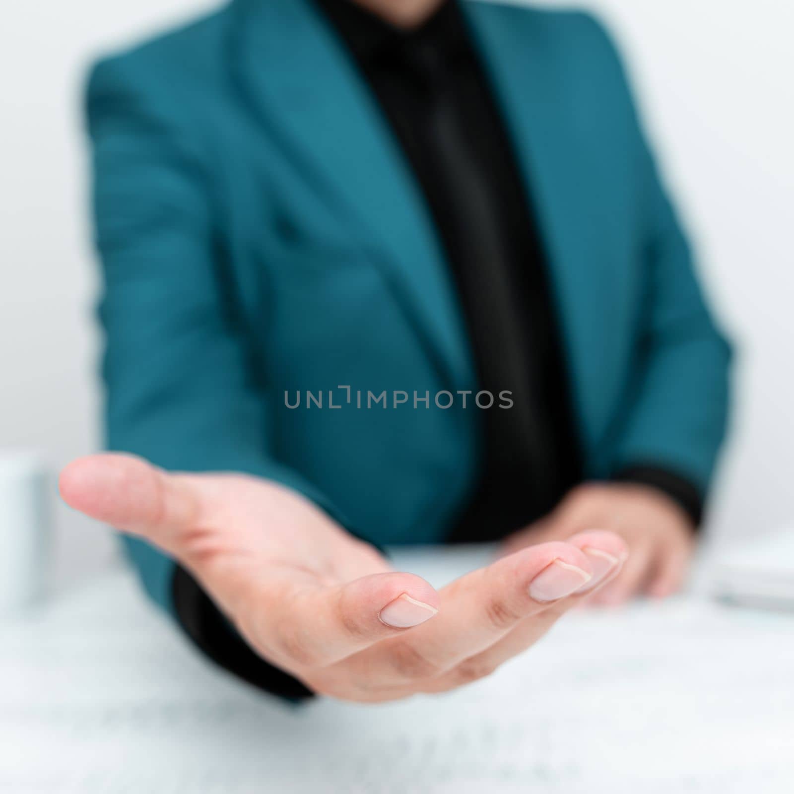 Businessman in Blue jacket Holding Important Message In One Hand. Man In Suit Showing New Crutial Idea In Palm. Executive Presenting Updated Critical Information. by nialowwa