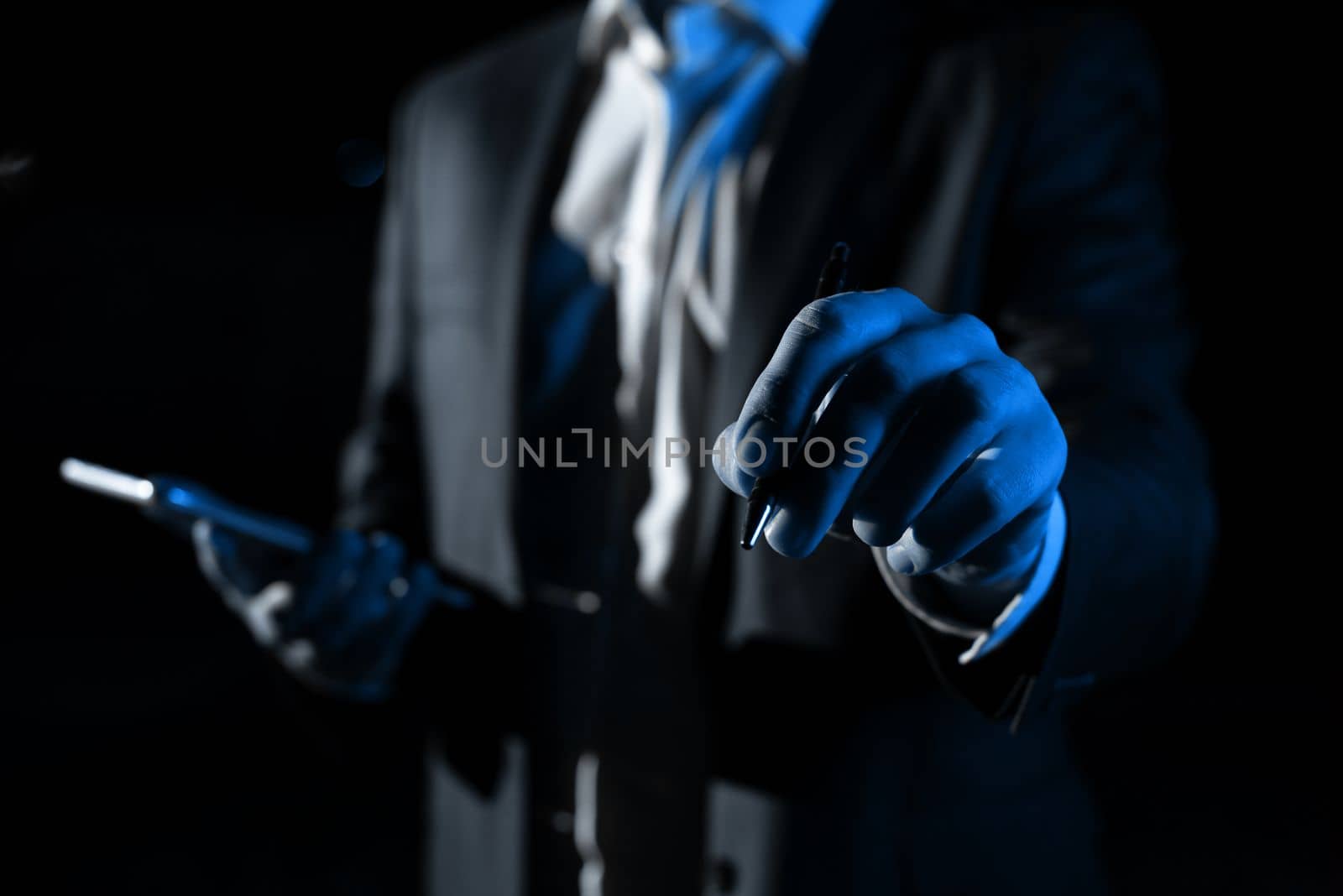 Man Holding Mobile Phone and Pointing On Recent Updates With Pen.