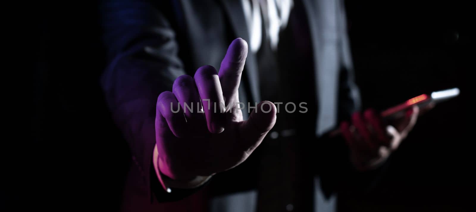 Man Holding Mobile Phone and Point On Recent Updates With One Finger.