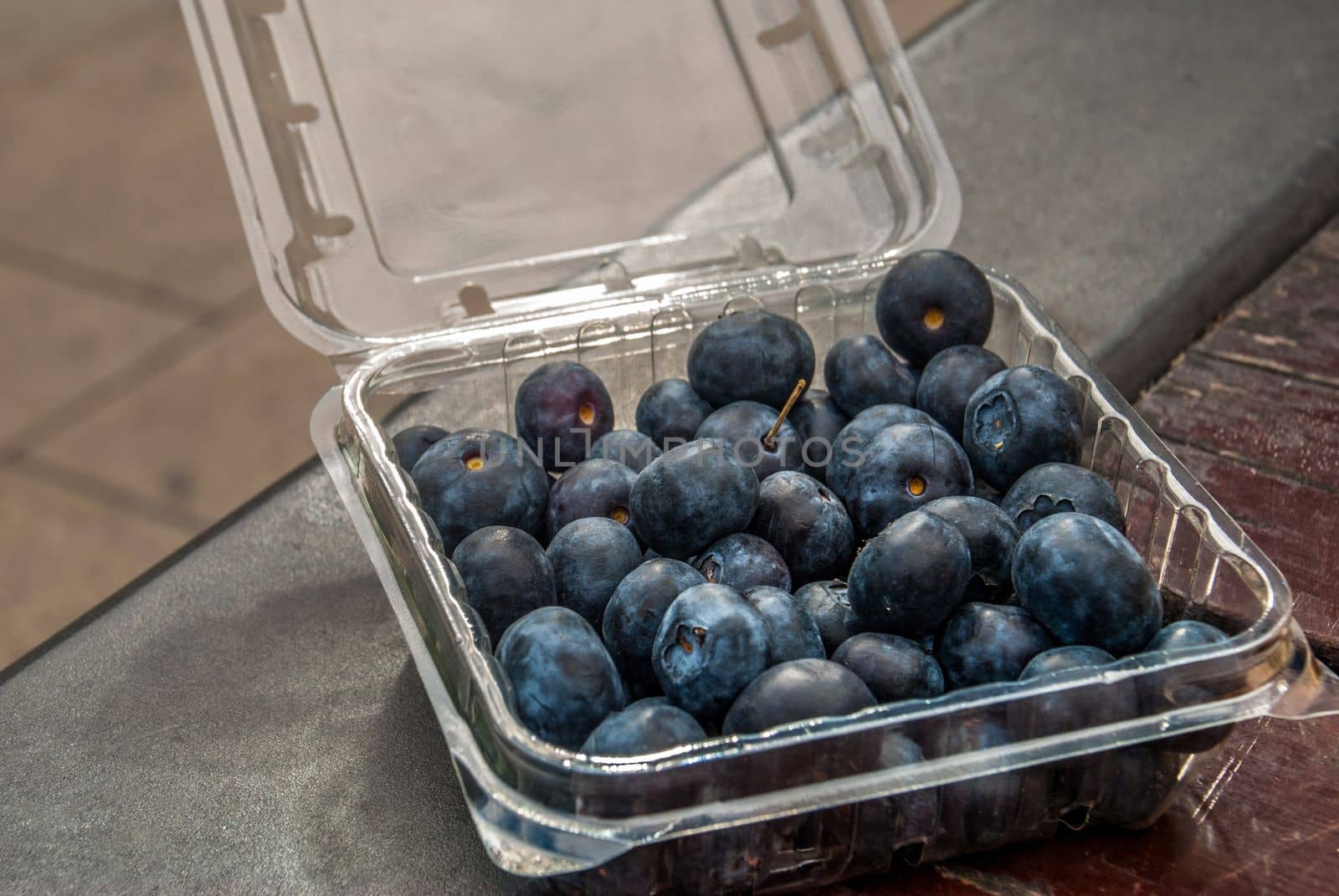 Black grapes in plastic boxes ready to eat
