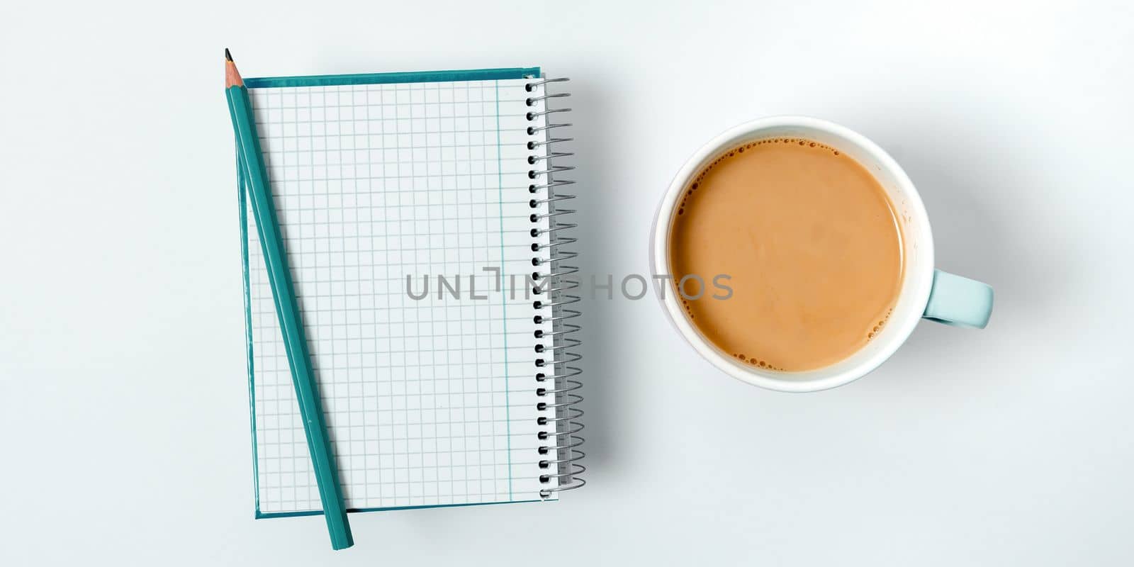 Coffee Cup Standing on Desk. Important infrormation written on paper. Different Office Supplies, Pencils, Pens, Marckers. Computer keyboard. Text on wood table. by nialowwa