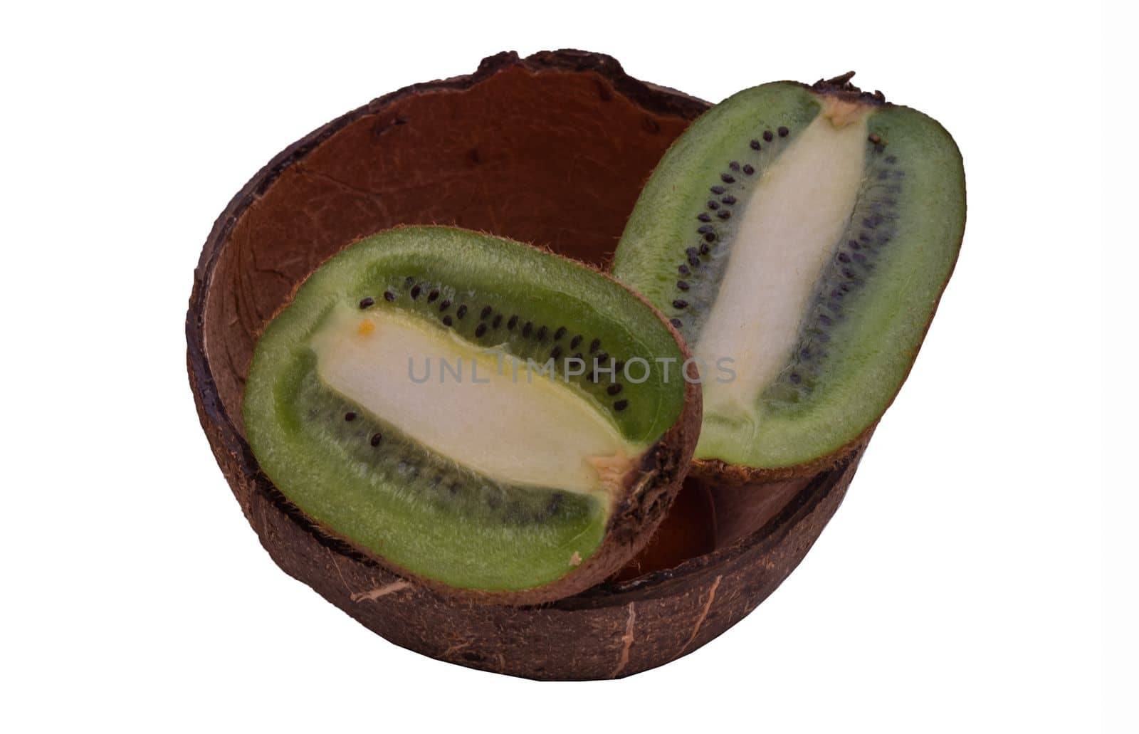Fresh kiwi in coconut shell on white background.