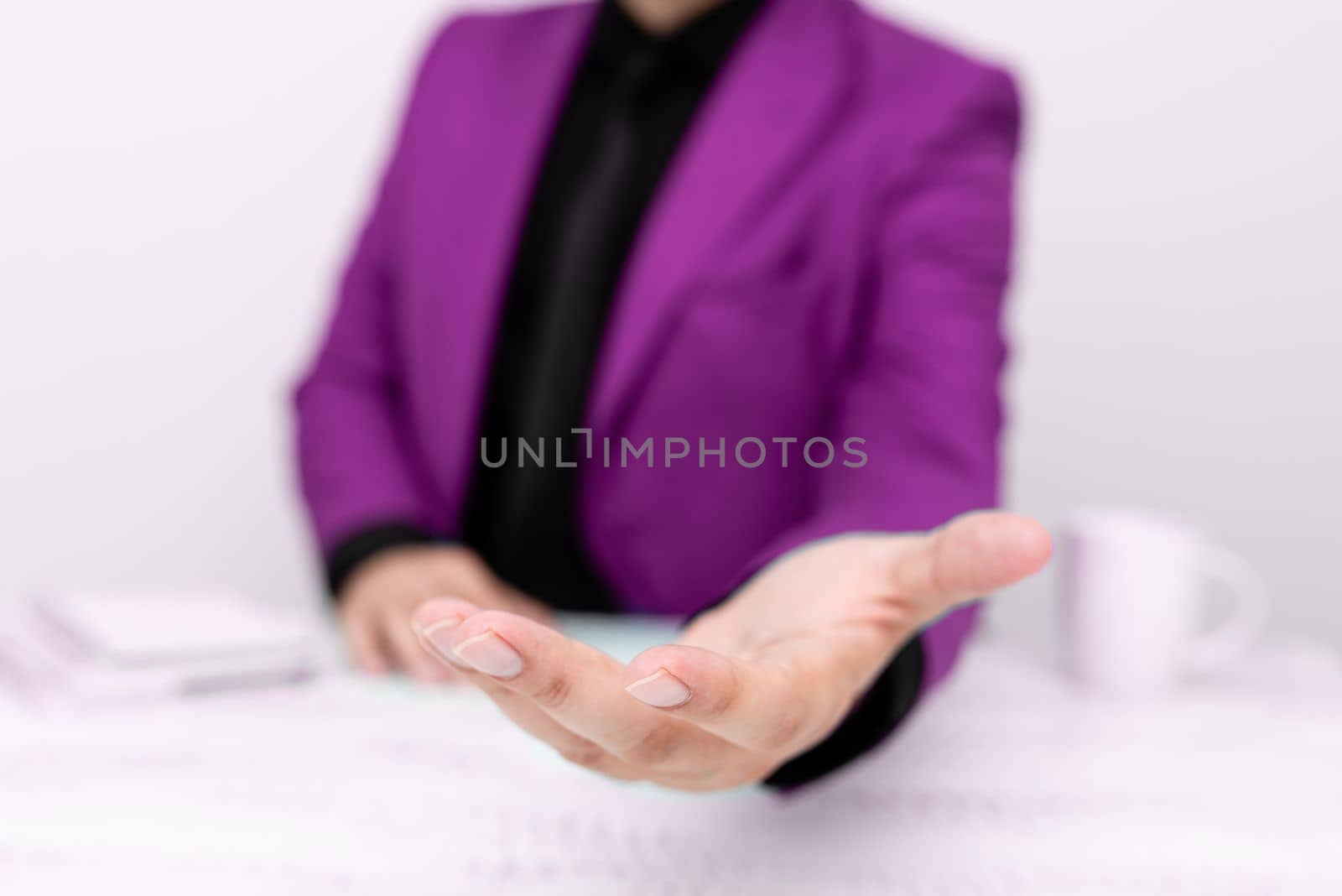 Businessman in Pink jacket Holding Important Message In One Hand. Man In Suit Showing New Crutial Idea In Palm. Executive Presenting Updated Critical Information. by nialowwa