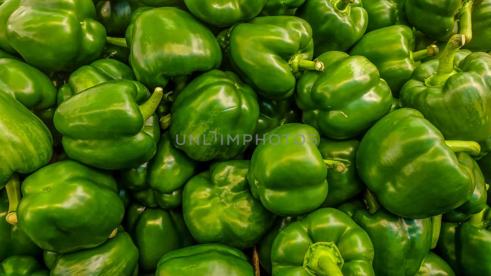 Picture of sweet green pepper (green Capsicum) In the market.
