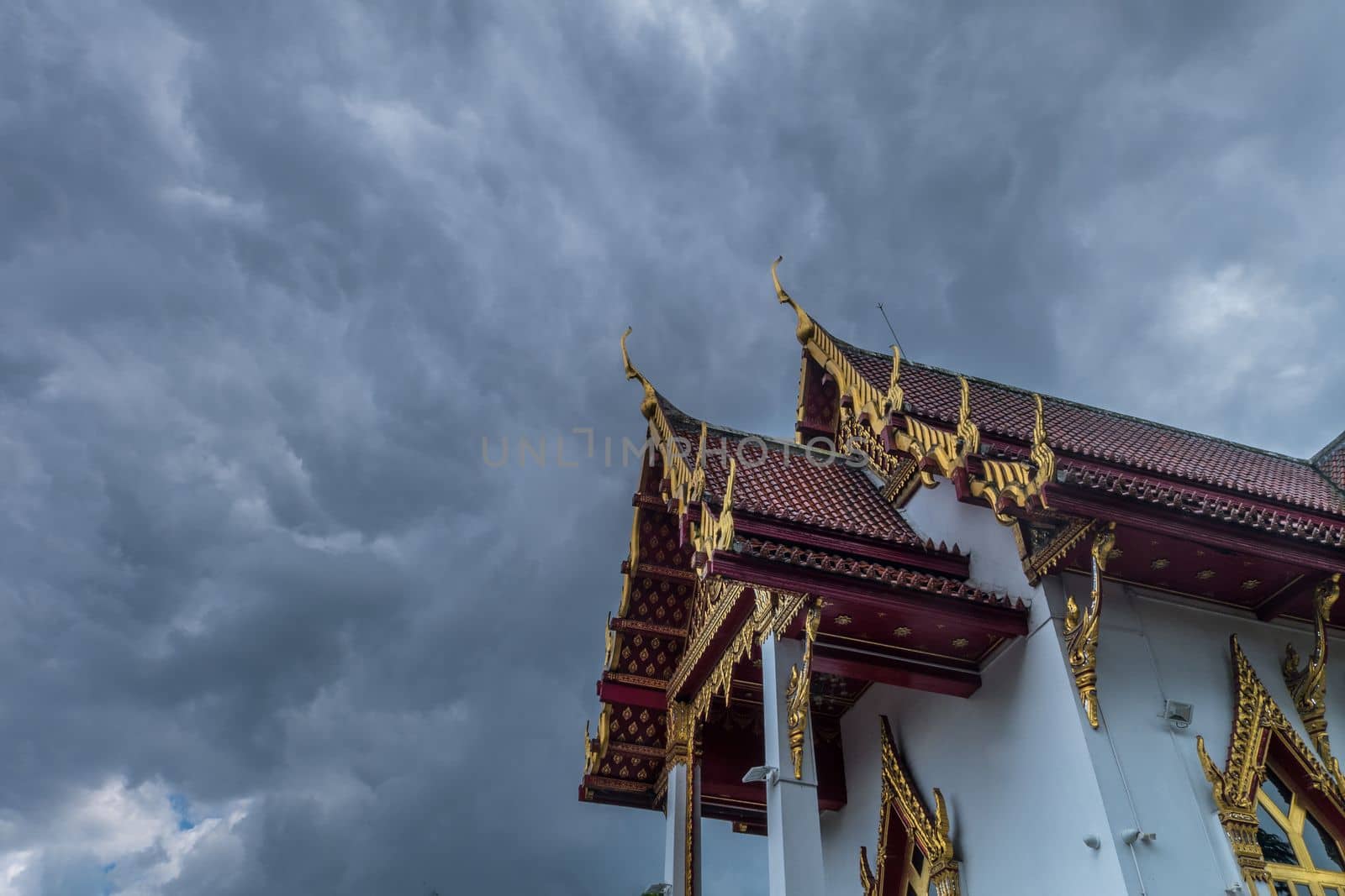 The roof of the Thai temple, along with the gable at the top of the church with a sky backdrop Suitable for making background images.