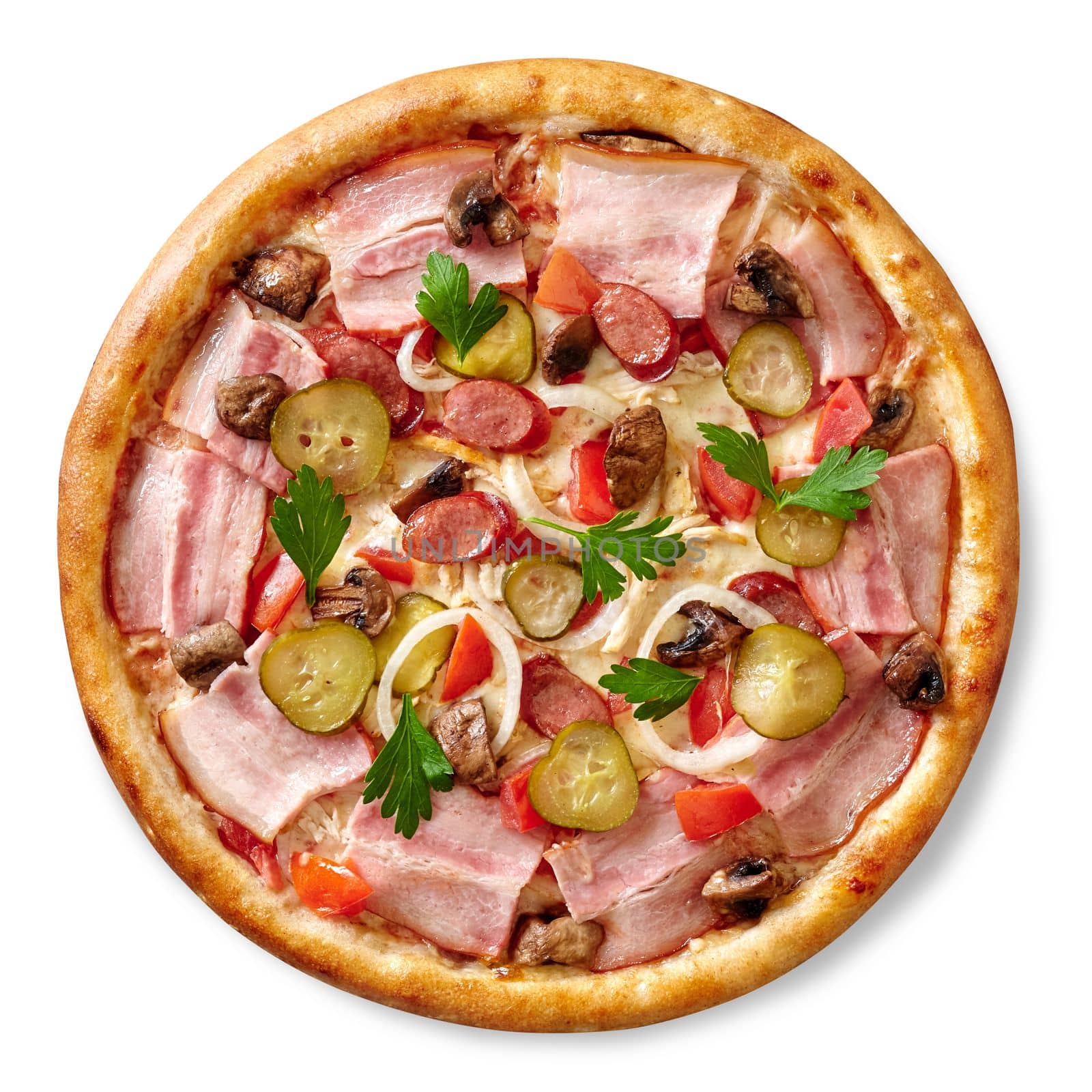 Hearty pizza in rustic style with chicken, hunting sausages and bacon in combination with pickles, mushrooms, onions and greens based on cheese sauce. Top view isolated on white background