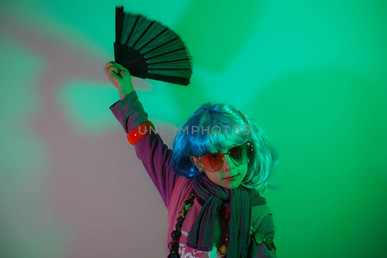 Little girl posing with a fan by bepsimage