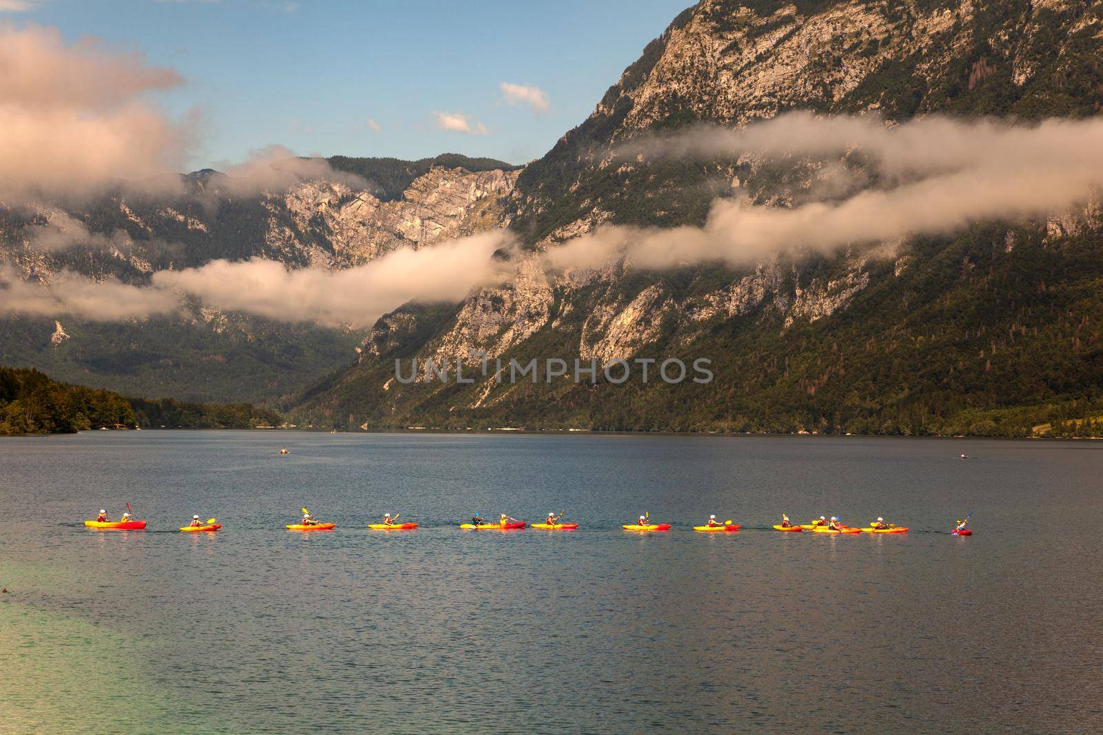 People kayaking in the Bohinj lake, Slovenia