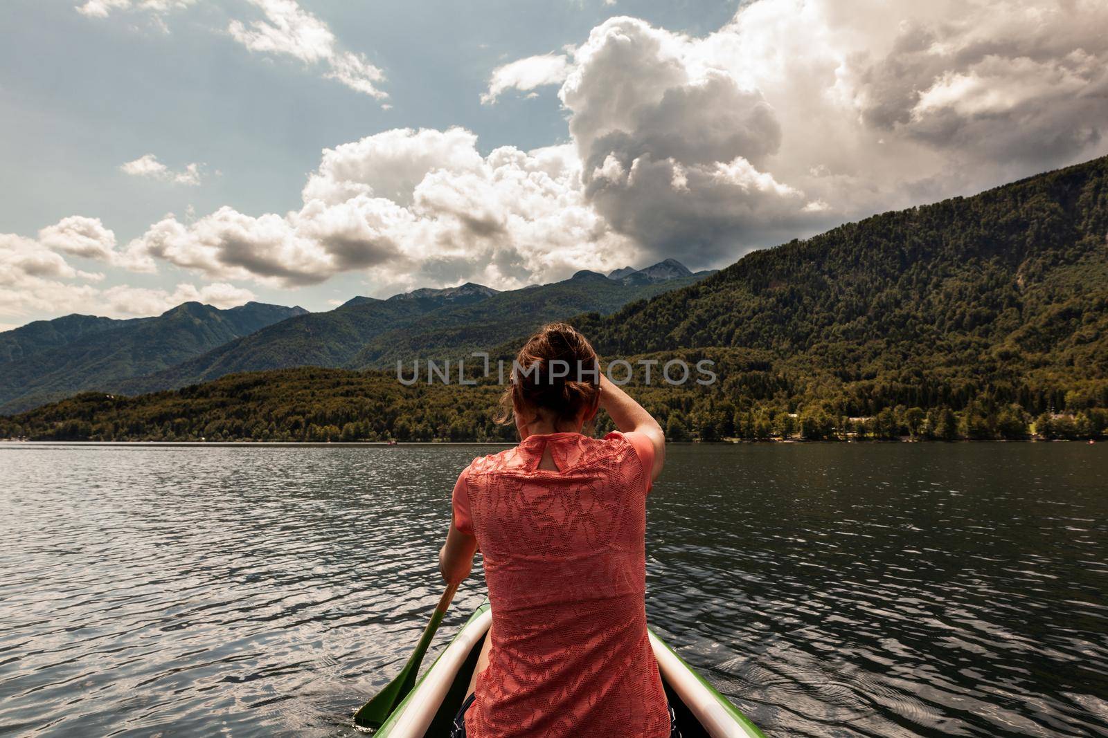 Girl kayaking in the Bohinj lake by bepsimage