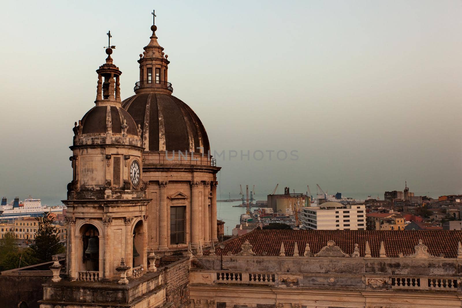 Top view of St. Agata church of Catania from the Badia church at sunset