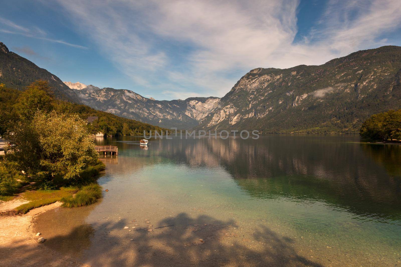 View of scenic Bohinj lake, the largest permanent lake in Slovenia, located within the Bohinj Valley of the Julian Alps