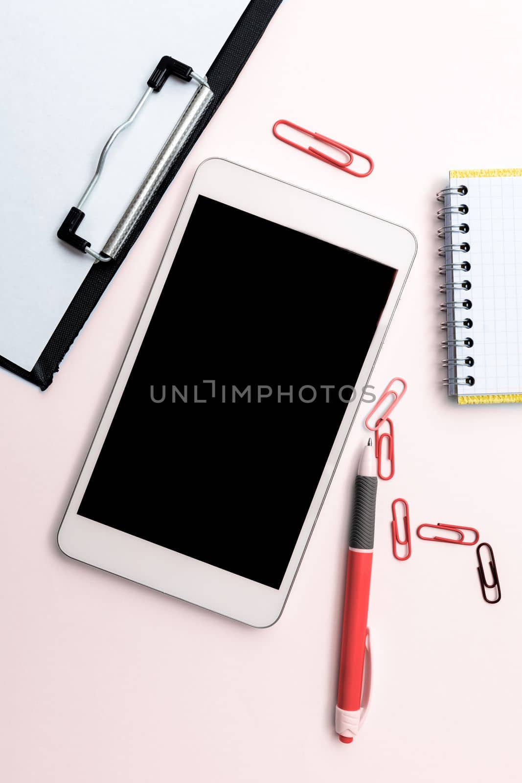 Phone Screen With Important Message On Desk With pens, Calculator And Notebook. Cellphone With Crutial Information On Table With Cup. Late Updates Presented. by nialowwa