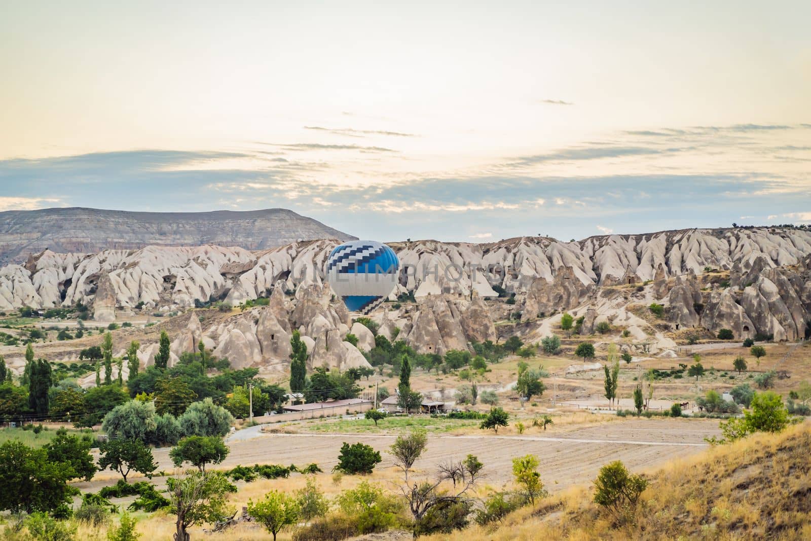 Colorful hot air balloon flying over Cappadocia, Turkey by galitskaya