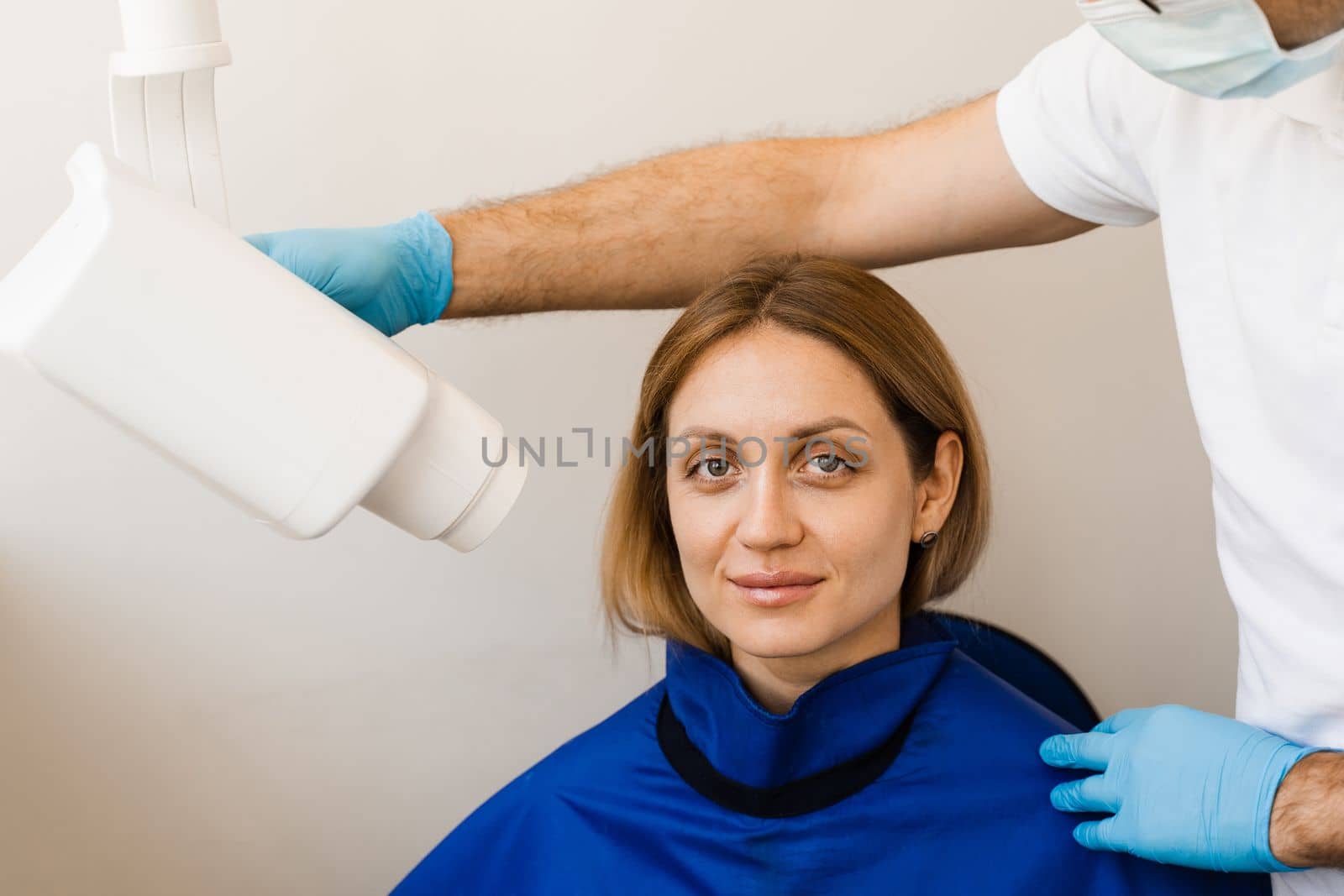 Dentist do x-ray tooth scan for woman in dentistry. Teeth x ray scanning for detect toothache and treat roots