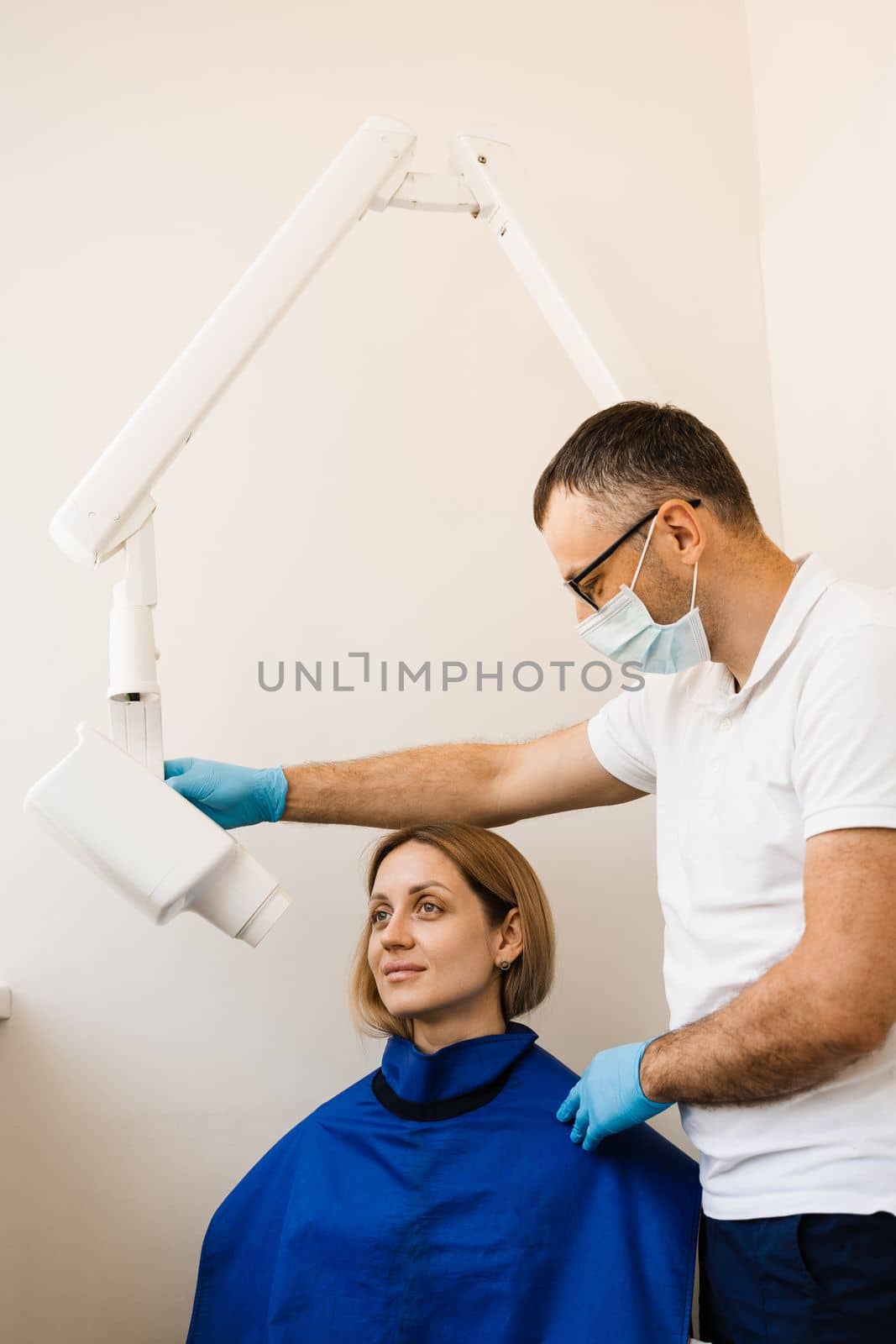 Dentist do x-ray tooth scan for woman in dentistry. Teeth x ray scanning for detect toothache and treat roots