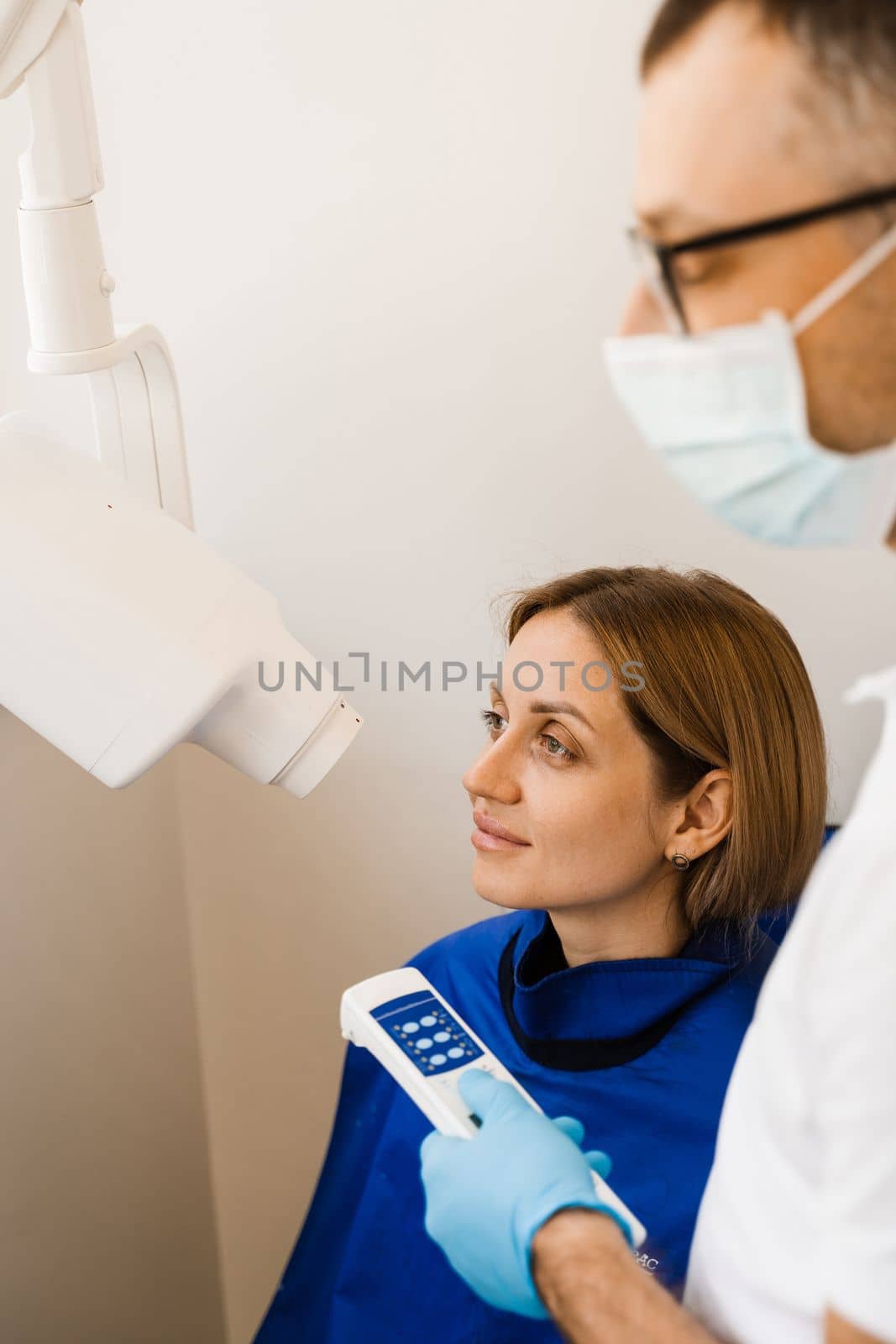 Dentist do x-ray tooth scan for woman in dentistry. Teeth x ray scanning for detect toothache and treat roots