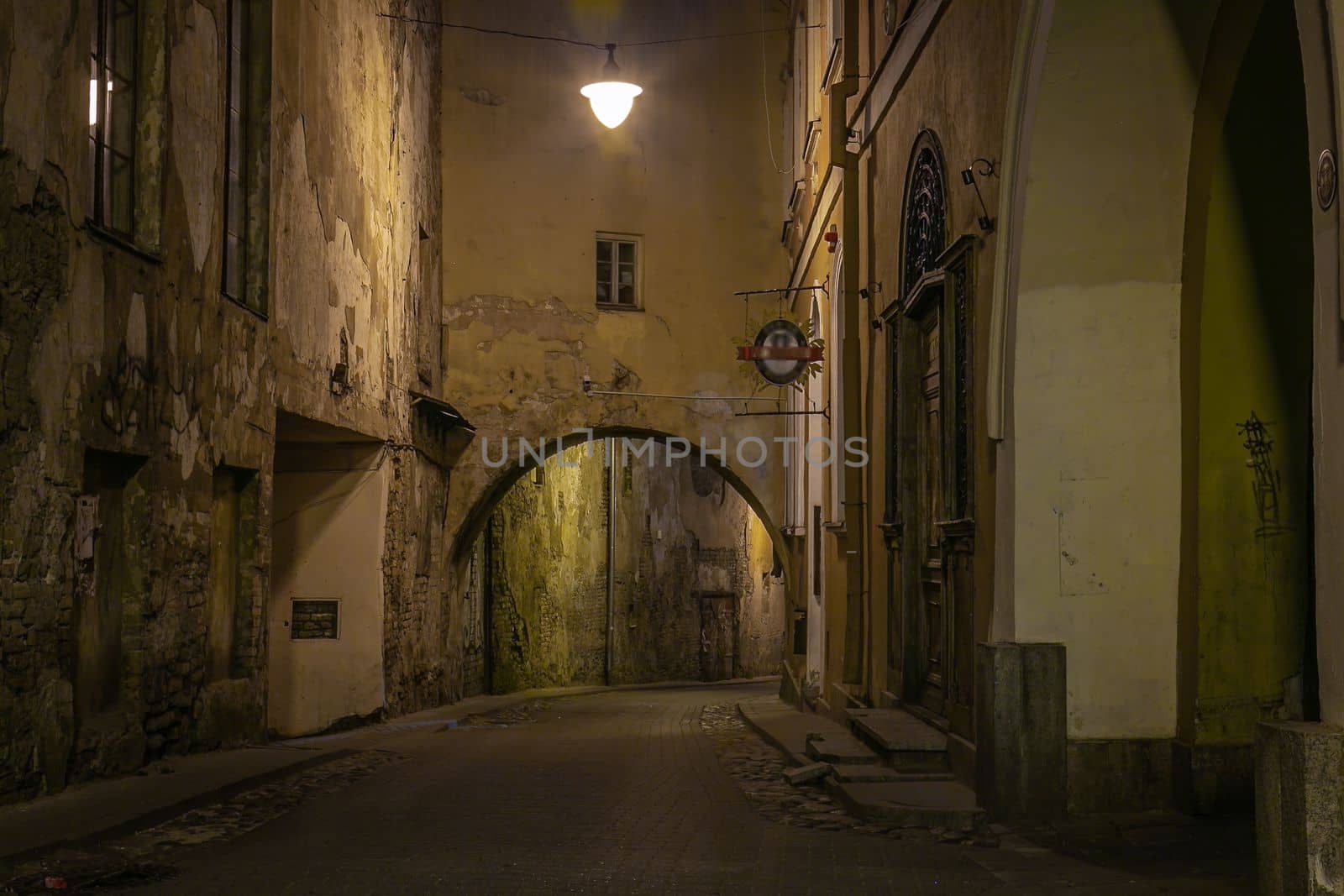 Vilnius old town street illuminated at night, Lithuania, Baltic countries