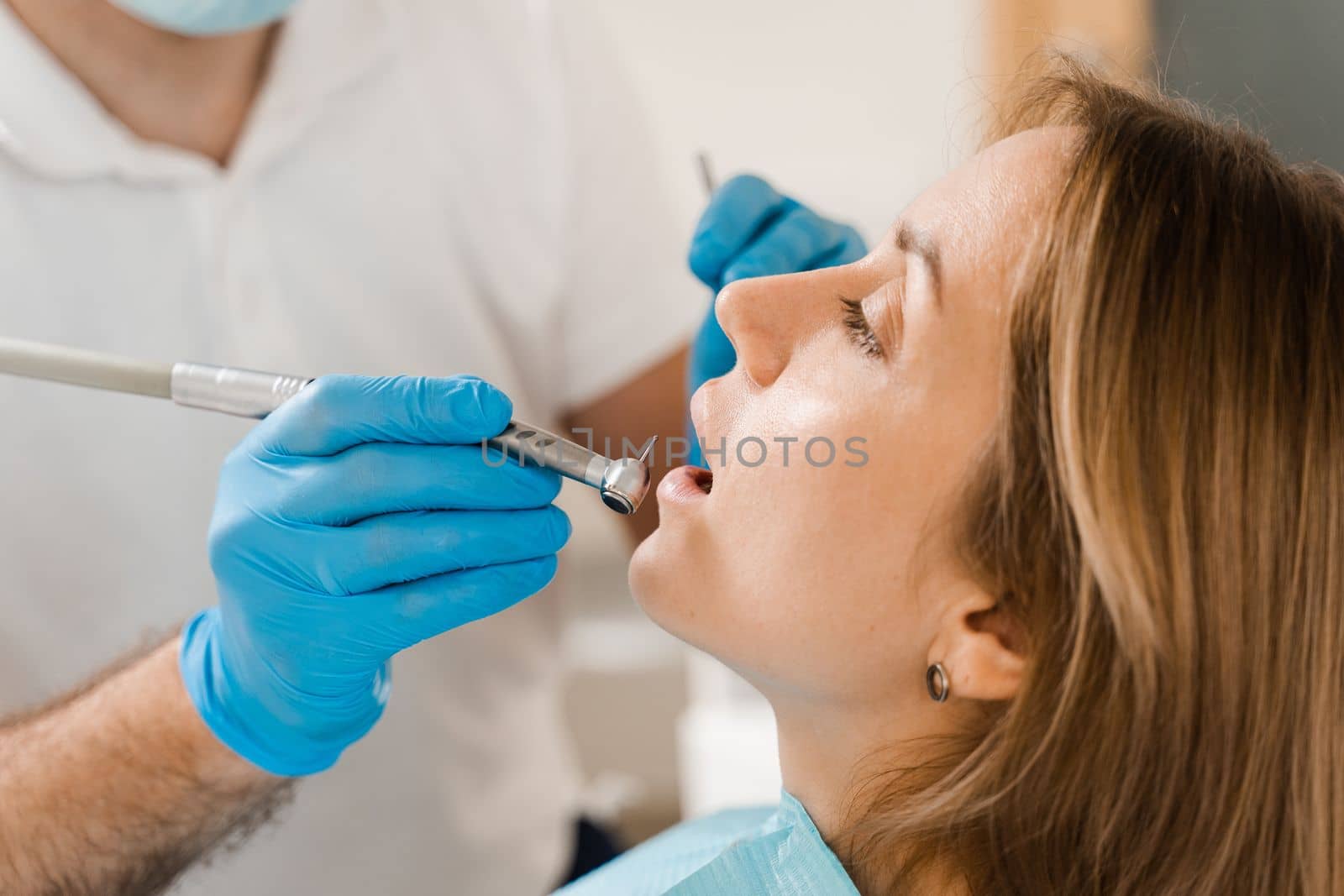 Dental drill close-up. Dentist drilling teeth of woman in dentistry clinic. Teeth treatment. Dental filling for girl patient