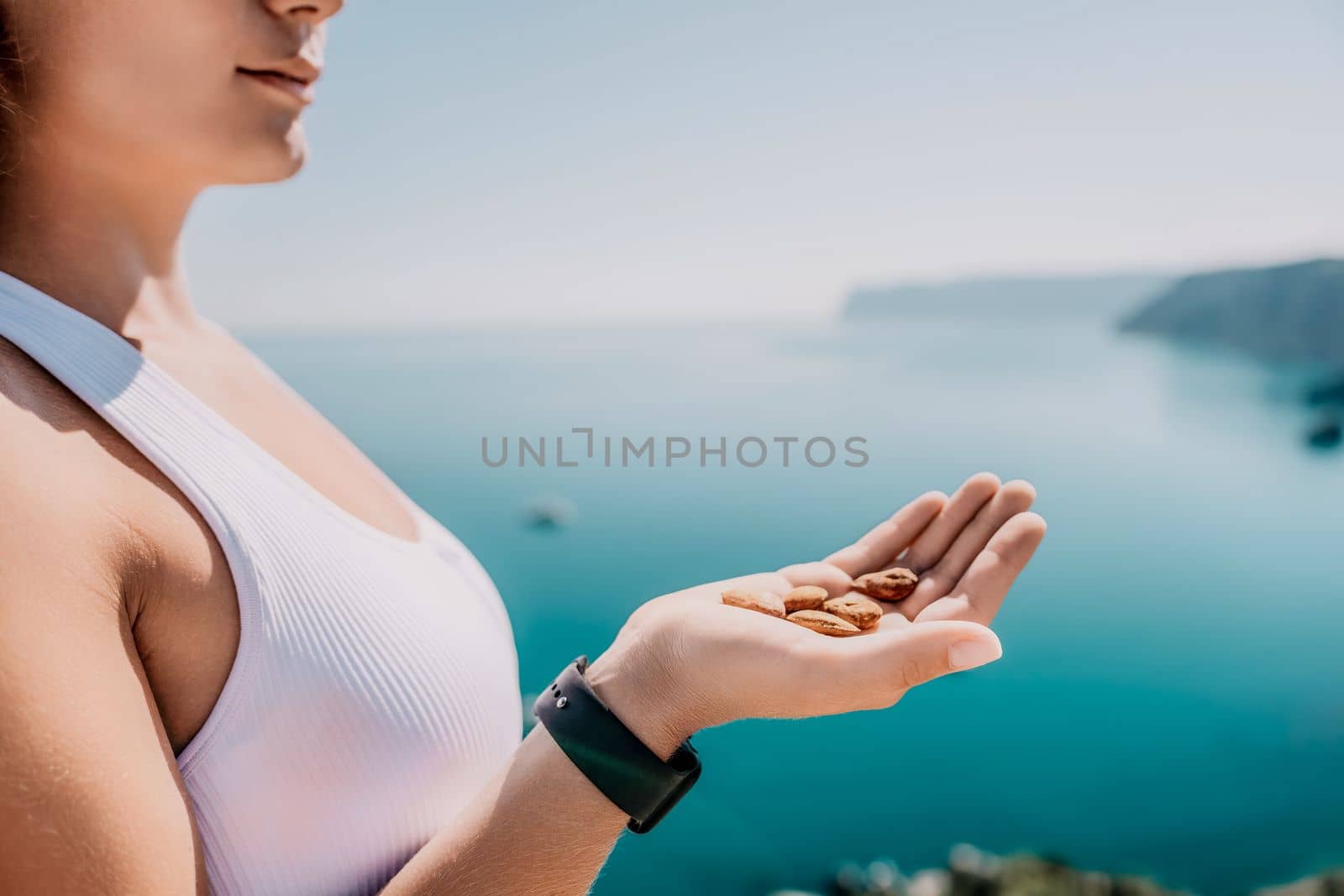 Unrecognizable caucasian woman eating young milky almond nuts. Healthy vegan food