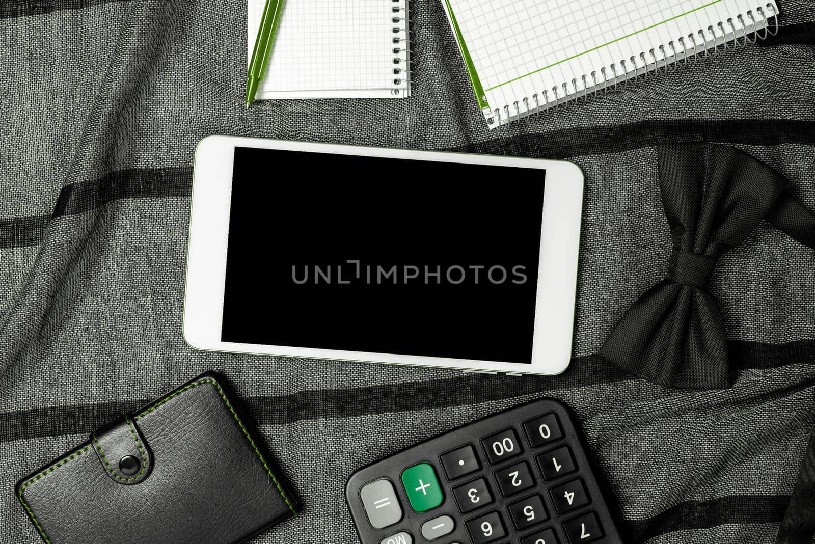 Mobile Phone With Important Message On fablic With Notebook And calculator. Cellphone With Crutial Information On Table With Clock. Late Updates Presented. by nialowwa