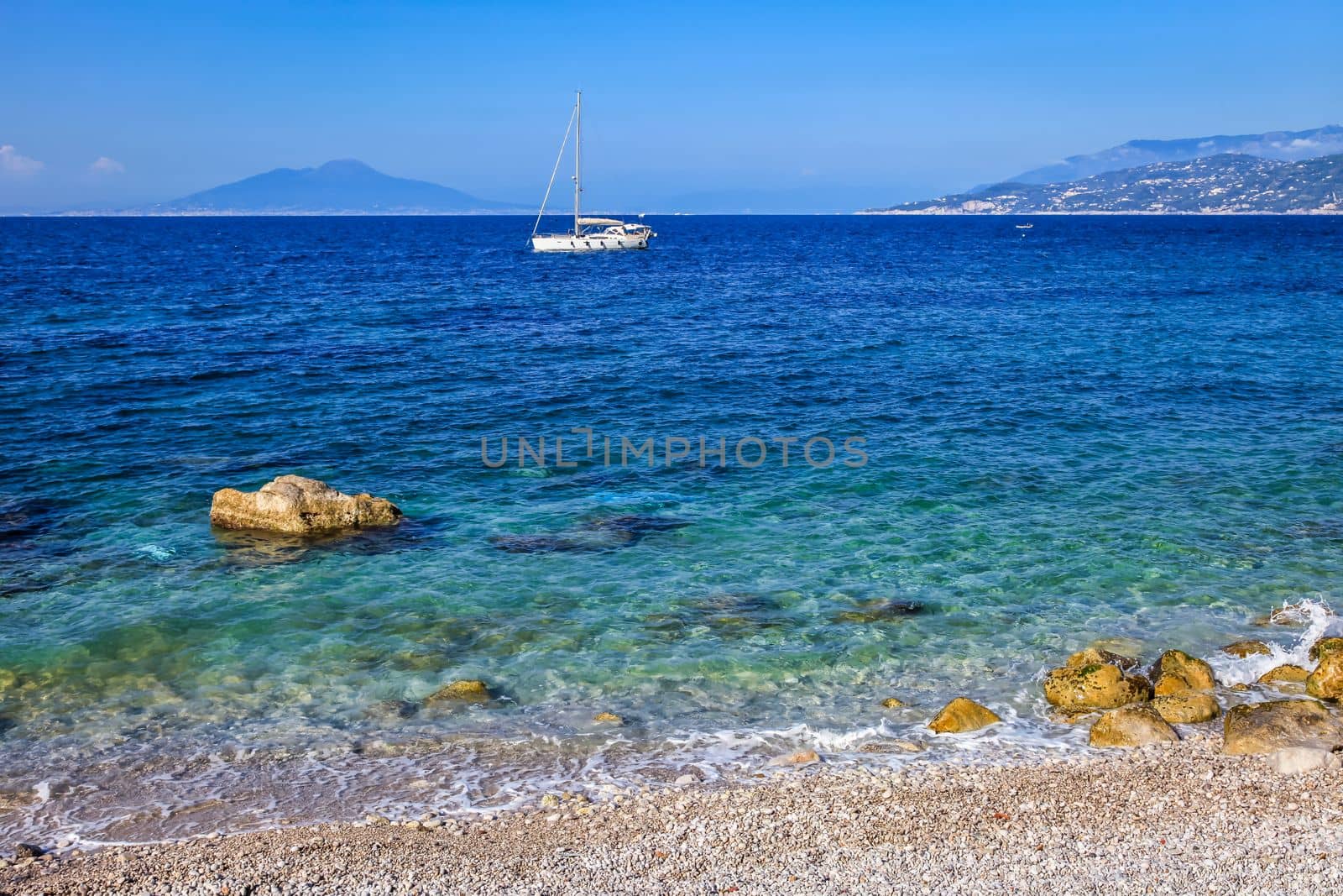 Capri beach and coastline with boats and sailboats, amalfi coast, Italy by positivetravelart