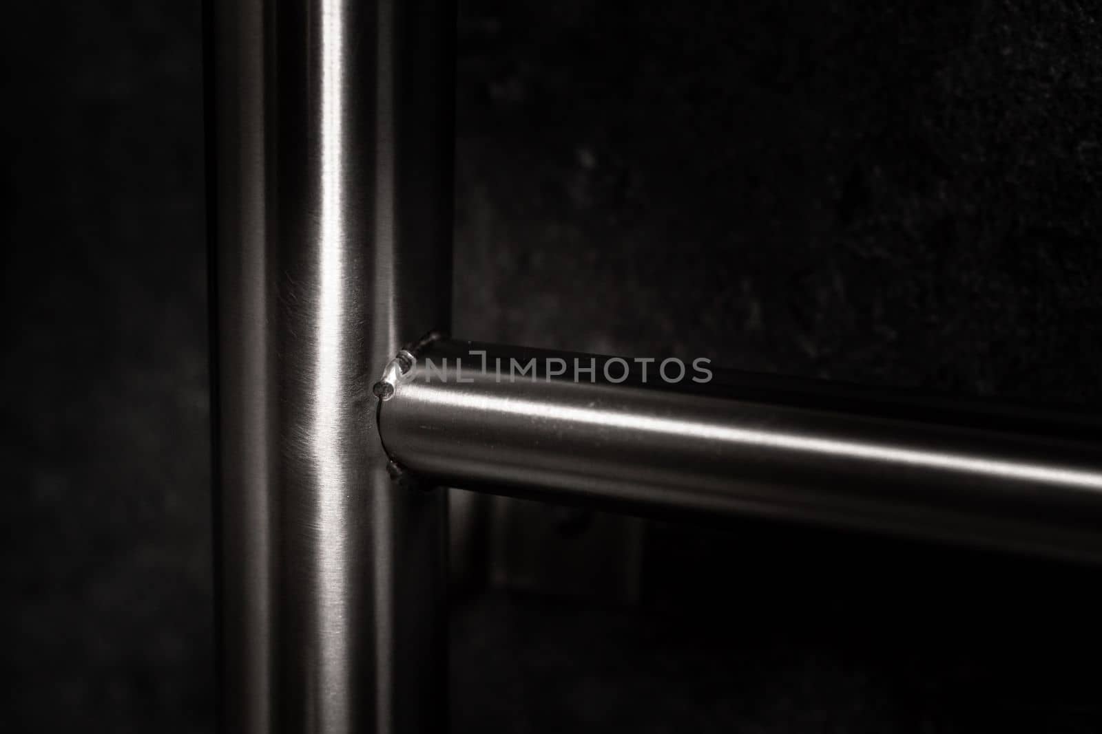 stainless steel railings on a dark background by Edophoto