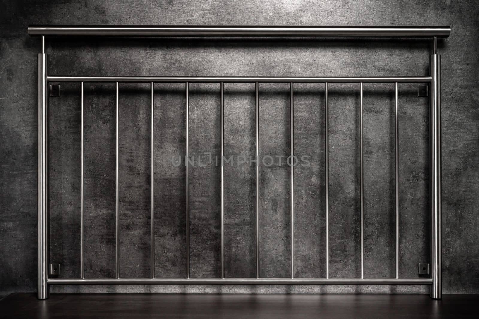 stainless steel railings on a dark background by Edophoto