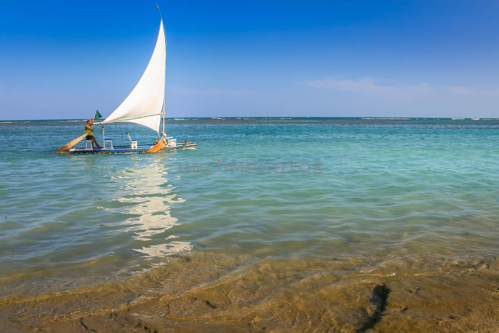 Carneiros Beach and jangada boat in Pernambuco at sunny day, Northeastern Brazil, South America