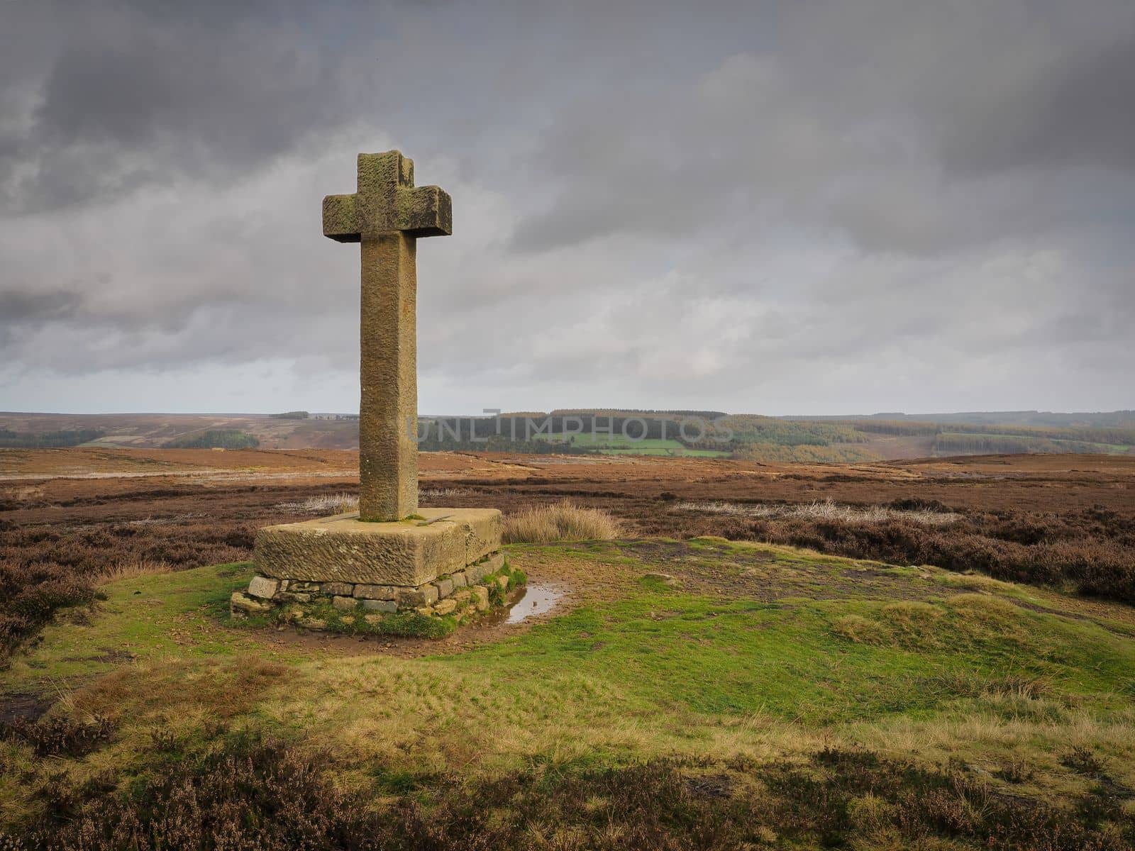 Ana Cross, an ancient stone monument marking the way, stands on top of Spaunton Moor overlooking the Rosedale valley, North York Moors National Park, UK