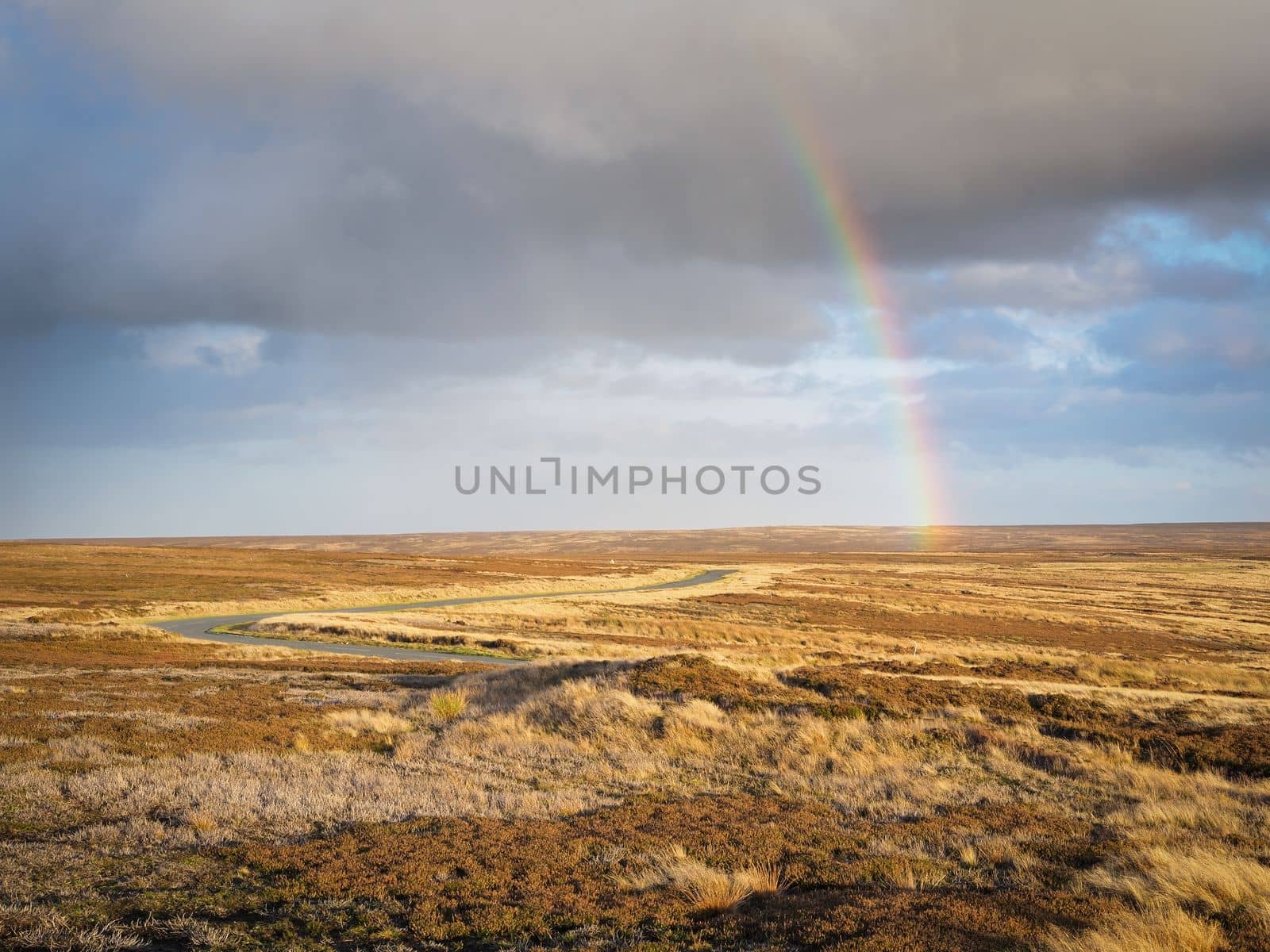 Rainbow over the winding road at head of the Rosedale valley, North York Moors by PhilHarland