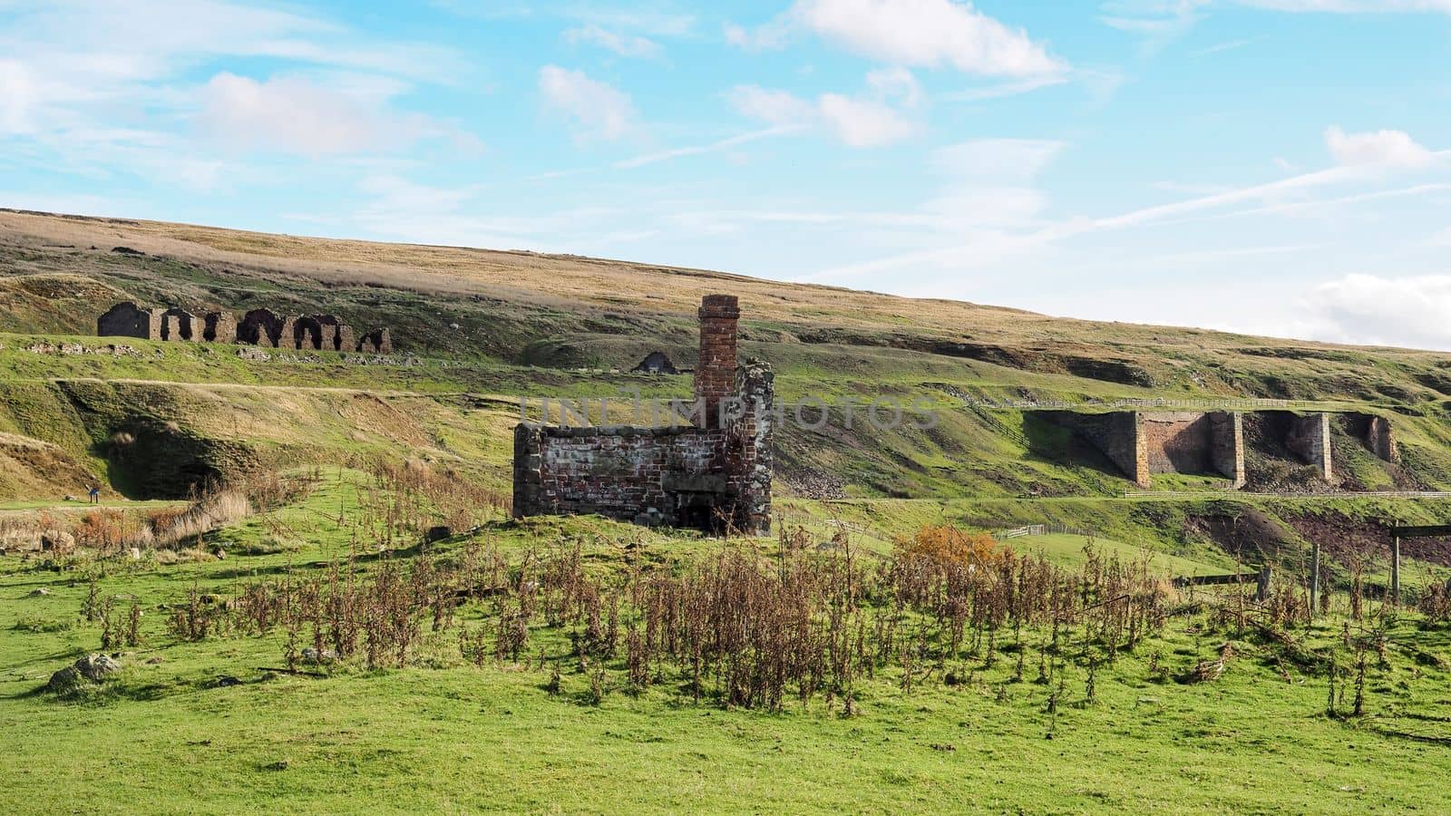 Derelict miners cottages and buildings and the ruins of the kilns of the East Rosedale Mines on the Rosedale Ironstone Railway, North York Moors National Park, UK