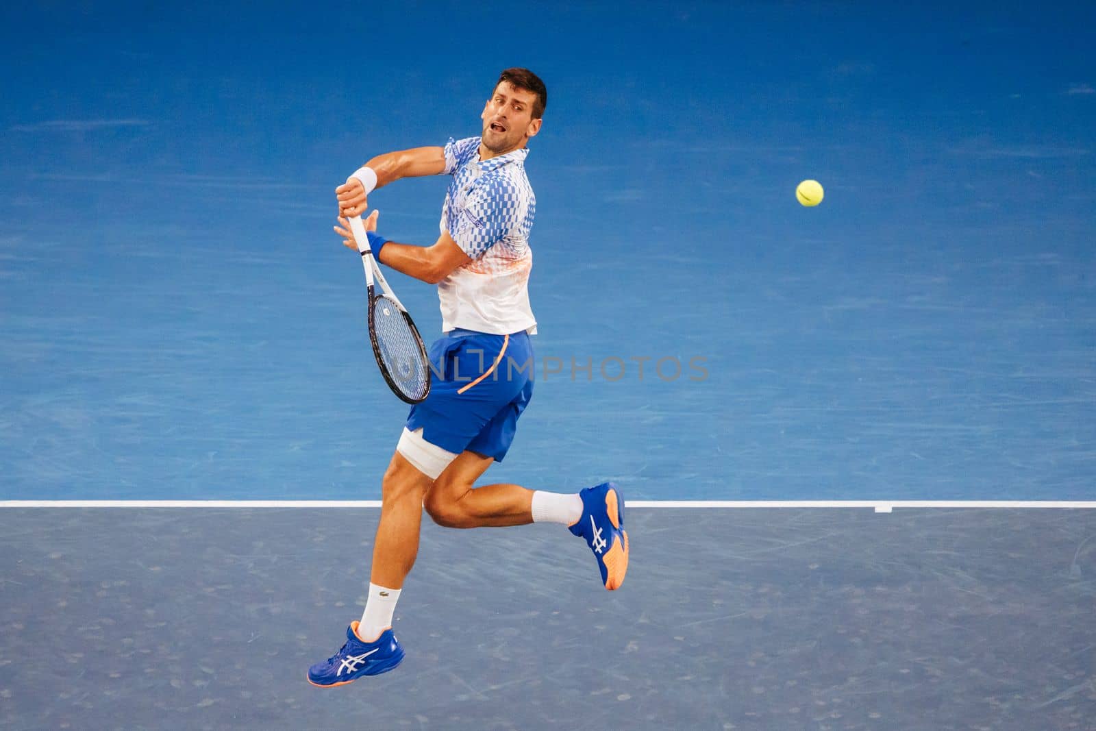 MELBOURNE, AUSTRALIA - JANUARY 23: Novak Djokovic of Serbia plays Alex de Minaur of Australia in the 4th round on day 8 of the 2023 Australian Open at Melbourne Park on January 23, 2023 in Melbourne, Australia.
