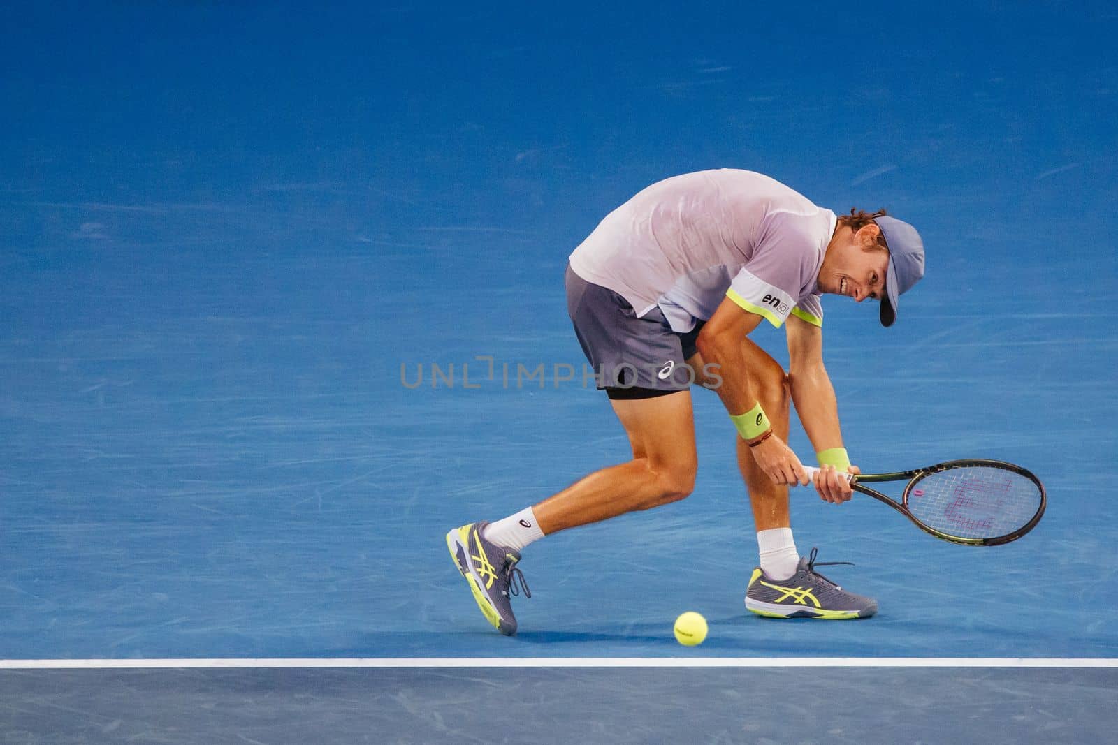 MELBOURNE, AUSTRALIA - JANUARY 23: Alex de Minaur of Australia plays Novak Djokovic of Serbia in the 4th round on day 8 of the 2023 Australian Open at Melbourne Park on January 23, 2023 in Melbourne, Australia.