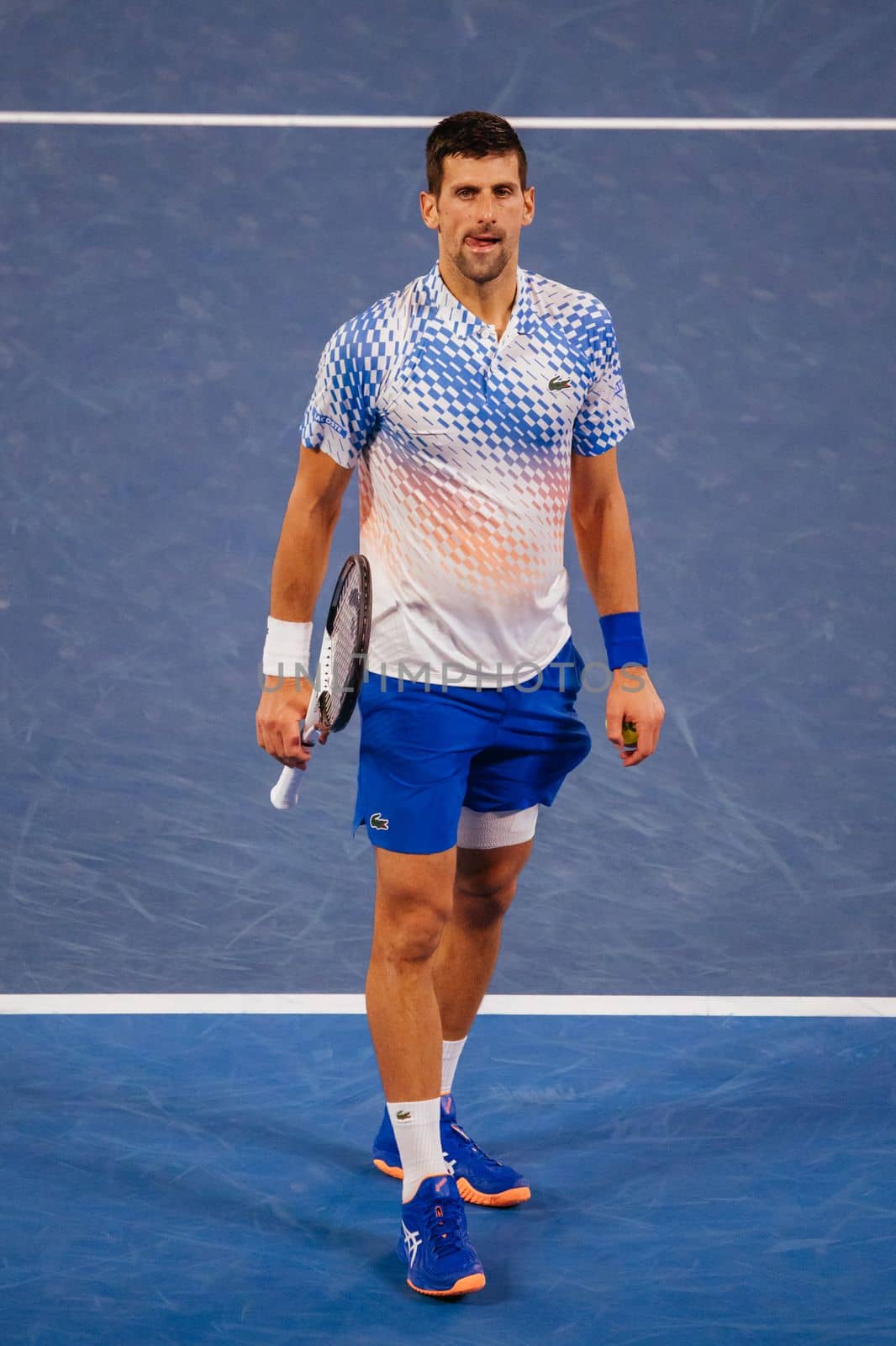 MELBOURNE, AUSTRALIA - JANUARY 23: Novak Djokovic of Serbia plays Alex de Minaur of Australia in the 4th round on day 8 of the 2023 Australian Open at Melbourne Park on January 23, 2023 in Melbourne, Australia.