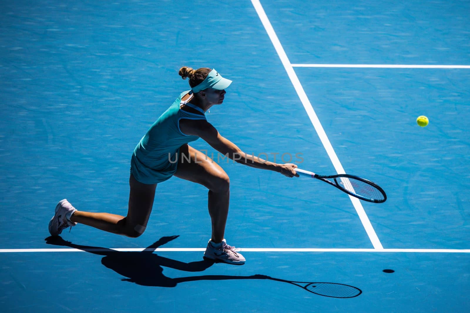 MELBOURNE, AUSTRALIA - JANUARY 23: Magda Linette of Poland plays Caroline Garcia of France on day 8 action of the 2023 Australian Open at Melbourne Park on January 23, 2023 in Melbourne, Australia.