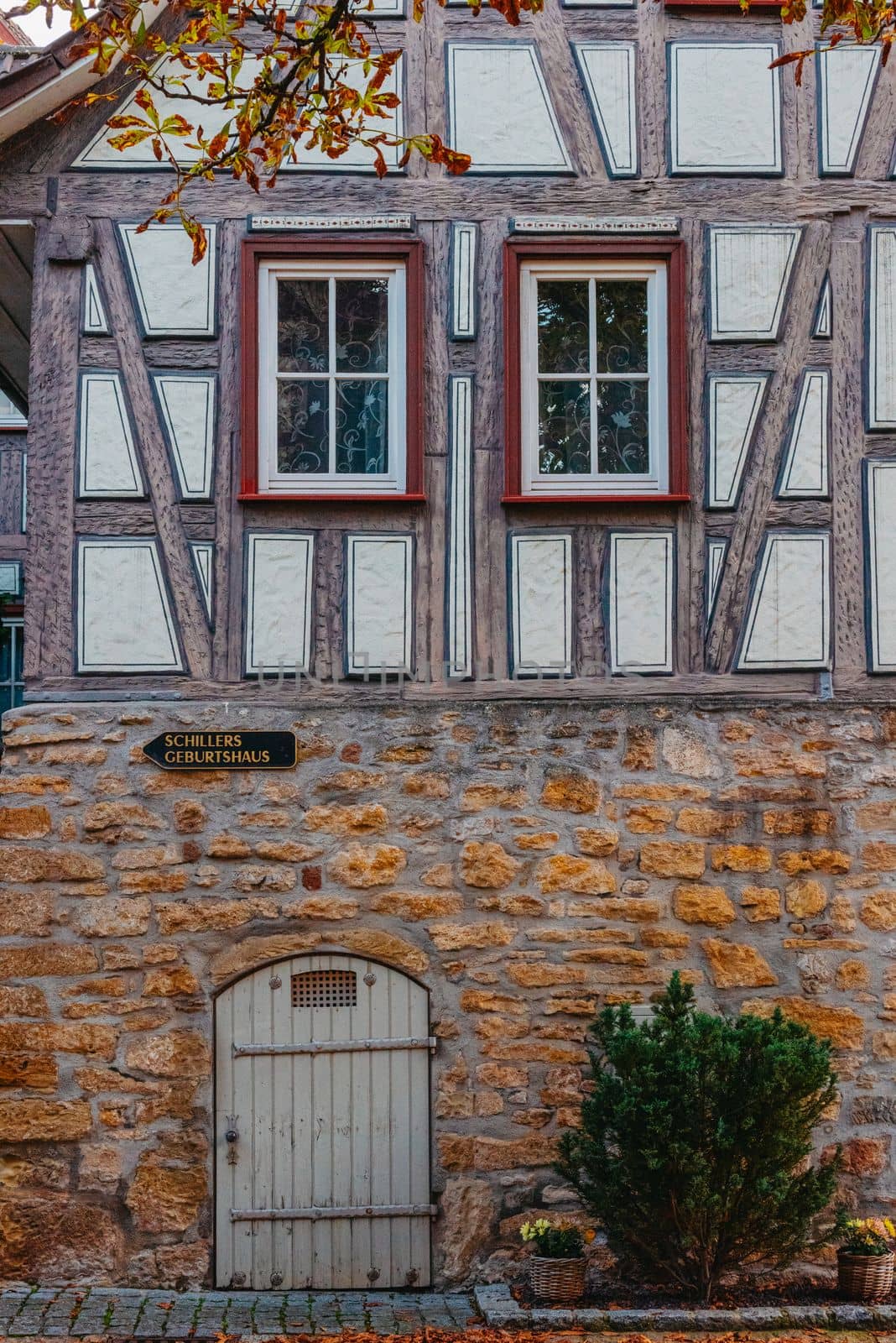 The Old Fachwerk houses in Germany. Scenic view of ancient medieval urban street architecture with half-timbered houses in the Old Town of Germany. by Andrii_Ko