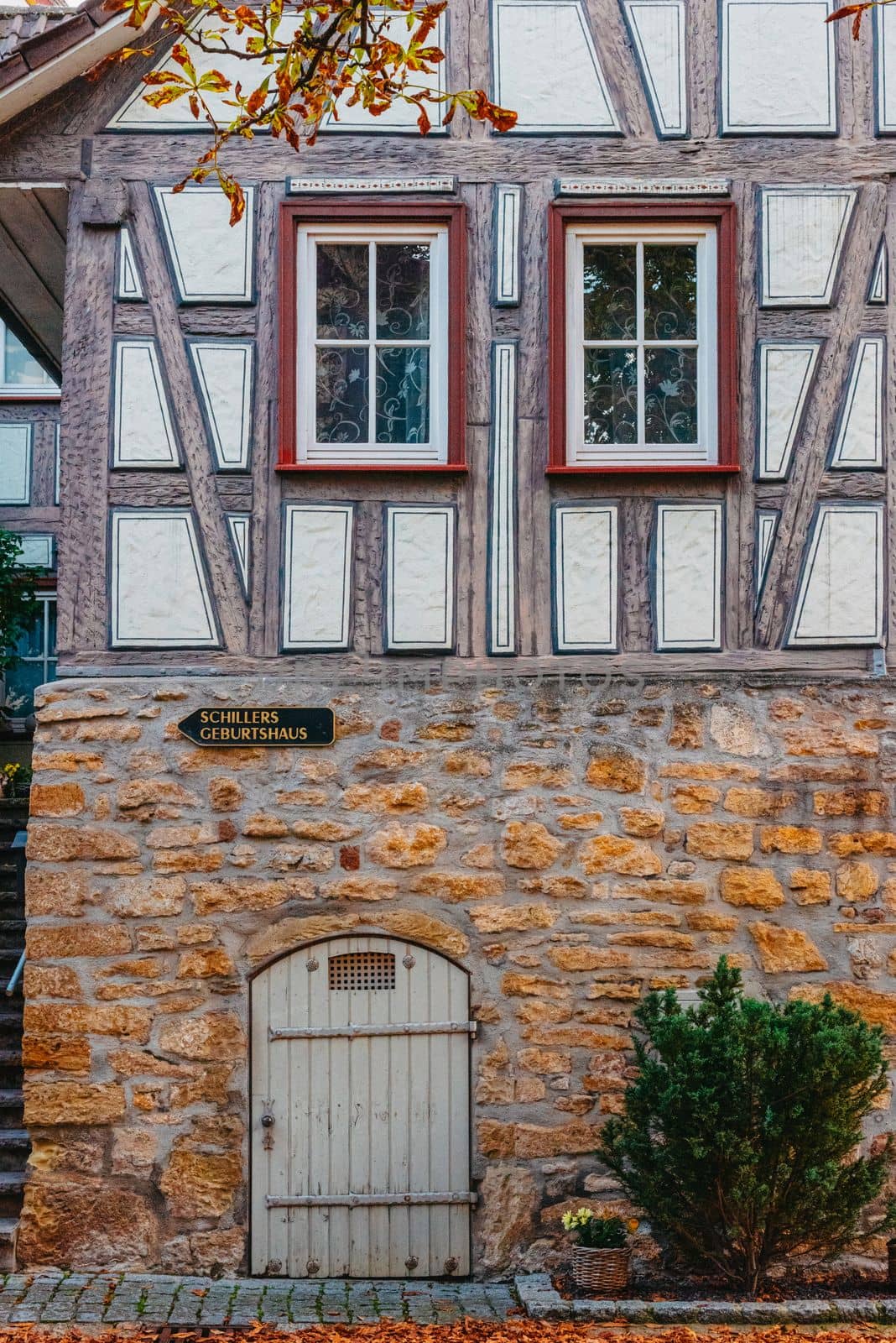 The Old Fachwerk houses in Germany. Scenic view of ancient medieval urban street architecture with half-timbered houses in the Old Town of Germany. by Andrii_Ko