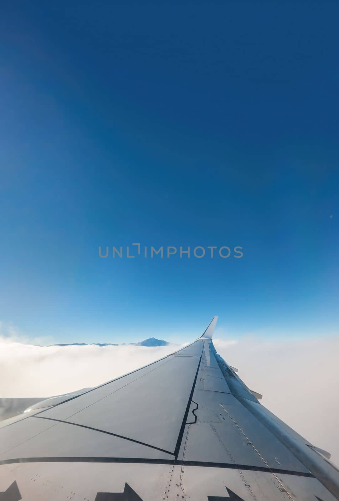 A View from the Plane of Tenerife's Teide and Blue Skies for text