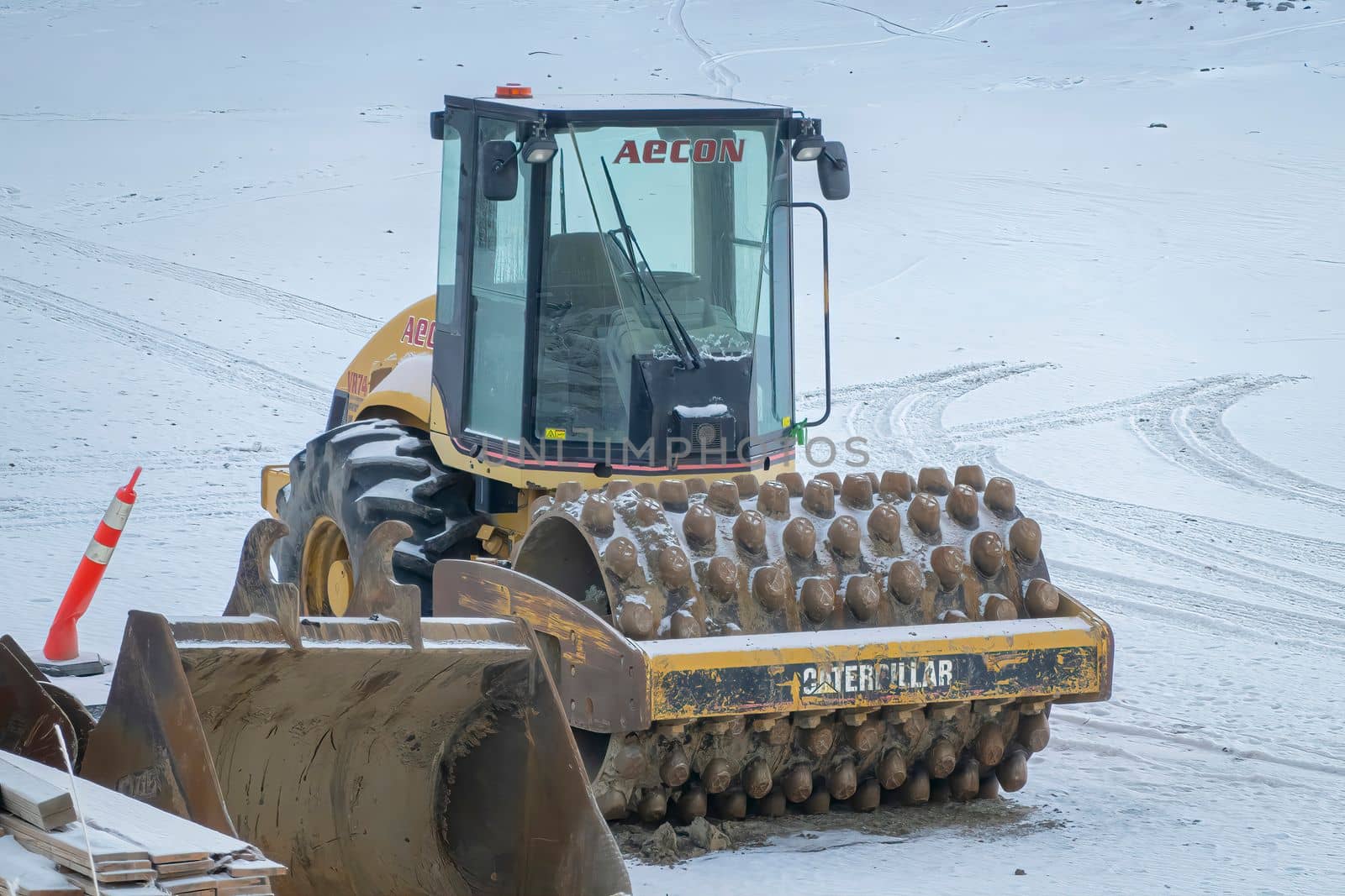 Calgary, Alberta, Canada. Dec 31, 2022. A Drum Vibrating Roller Compactor Construction Machine. A Vibratory Soil Compactor during winter. by oasisamuel