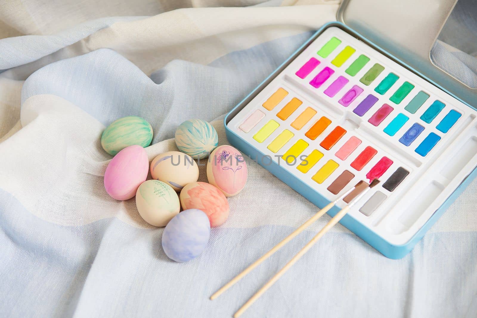 Painted colorful Easter eggs that are painted with watercolor paint. Hand-painted